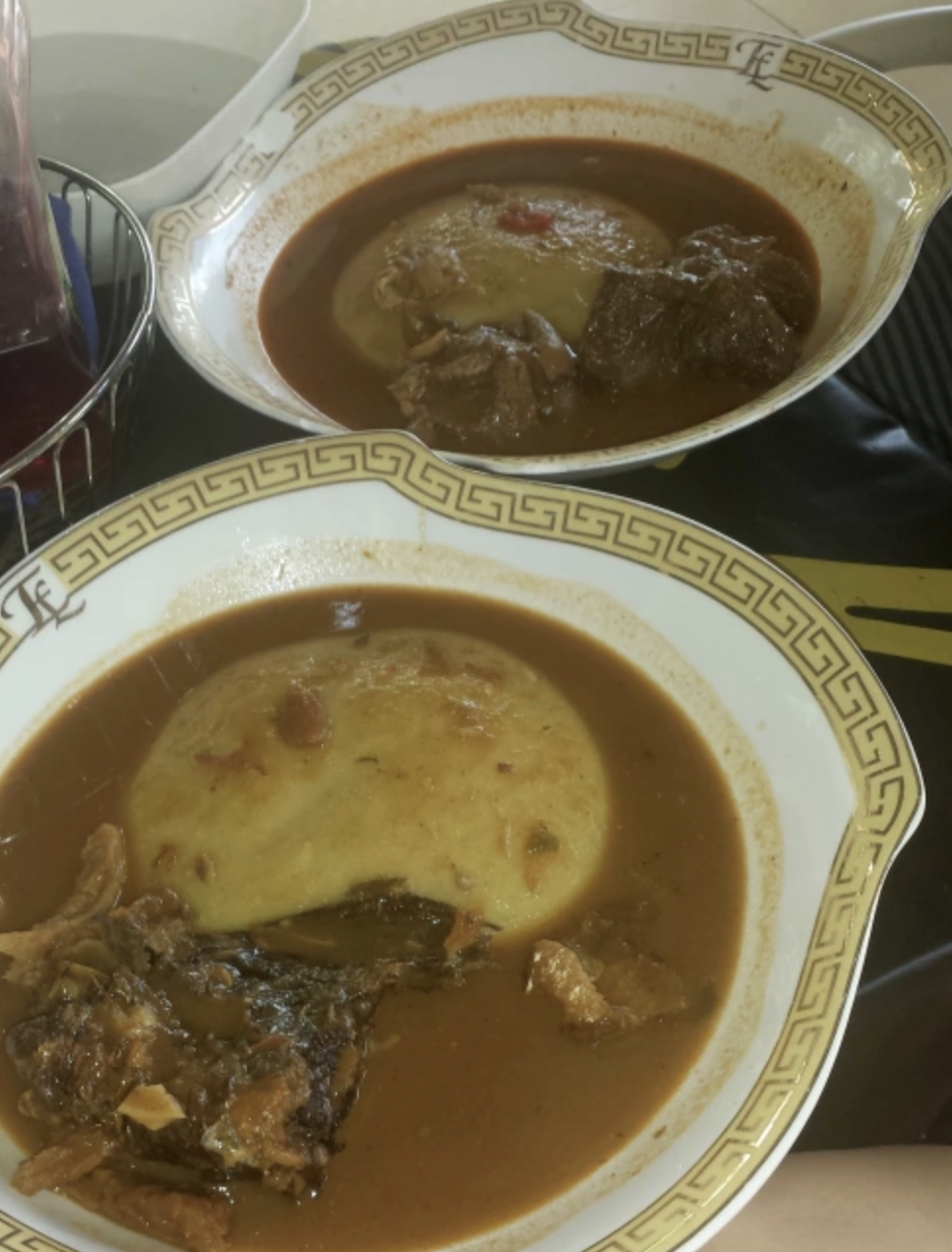  Fufu (pounded cassava plant) served in light soup with grilled fish and cow meat 