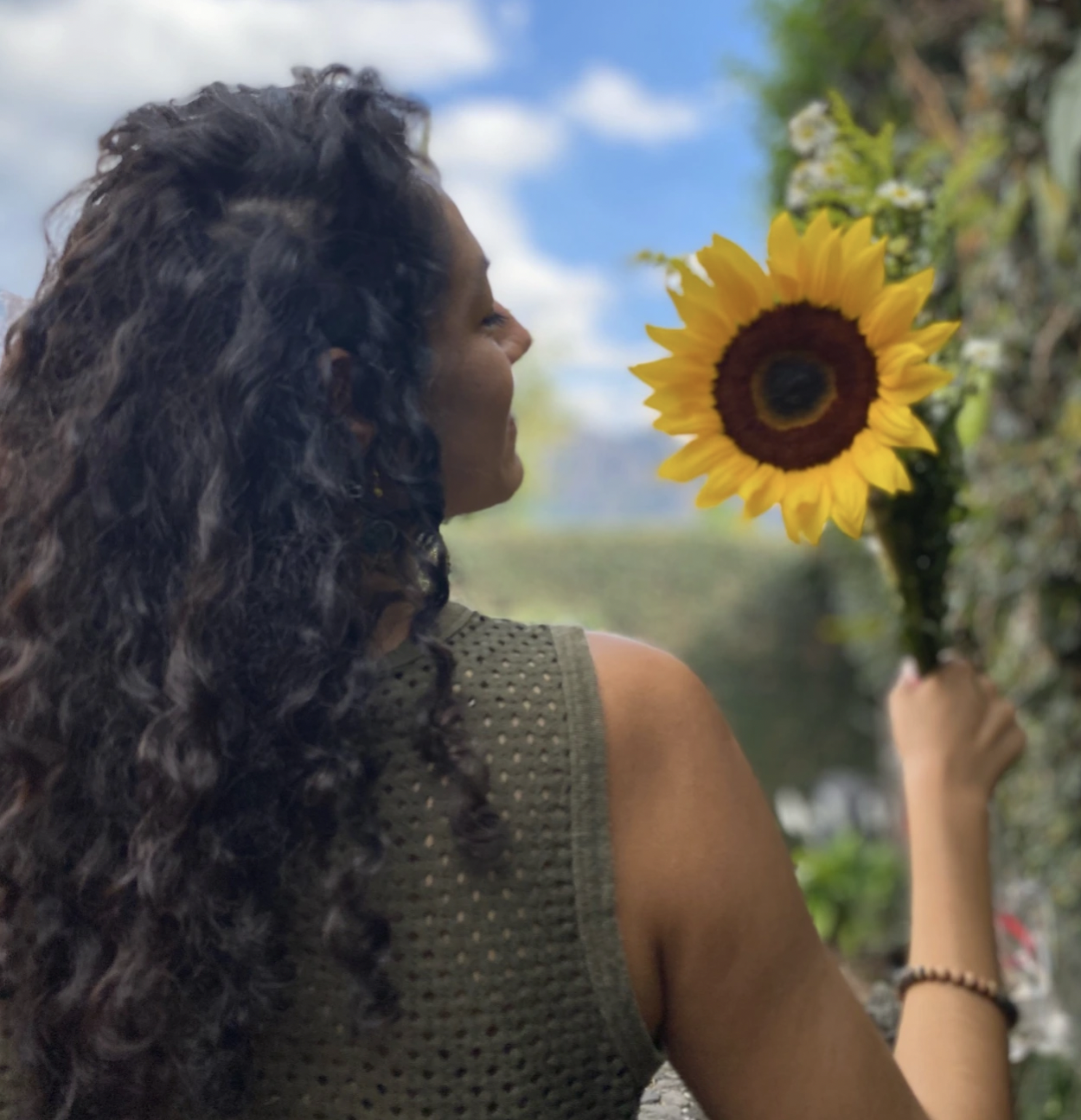 Anasheila and a sunflower in Tepoztlán, Morelos