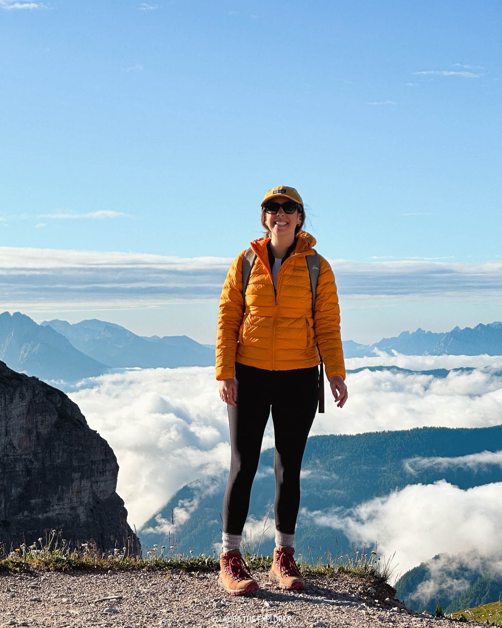 girl wearing warm layers in the dolomites