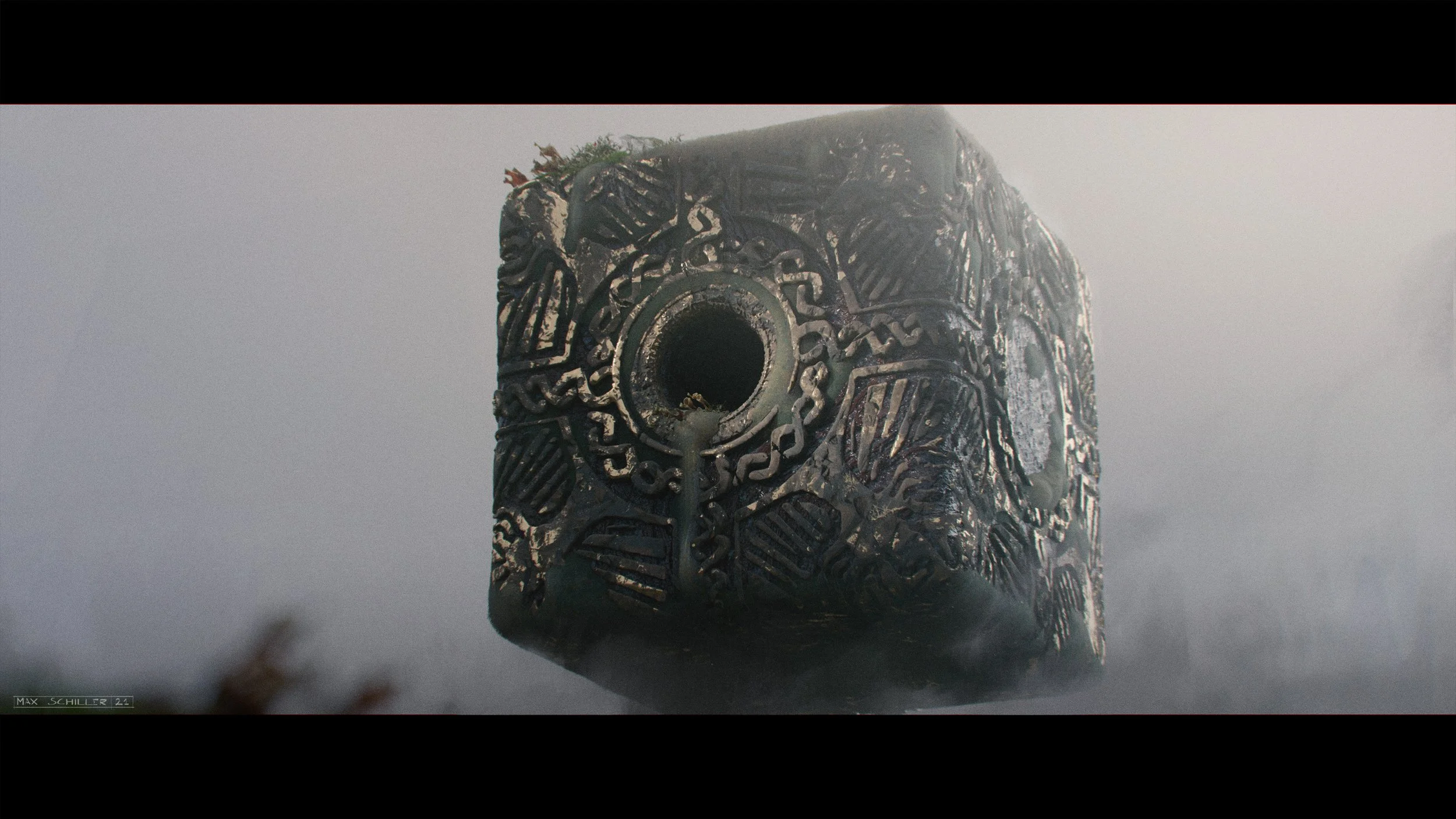 A close-up of a carved stone monument with intricate patterns, set against a foggy background.