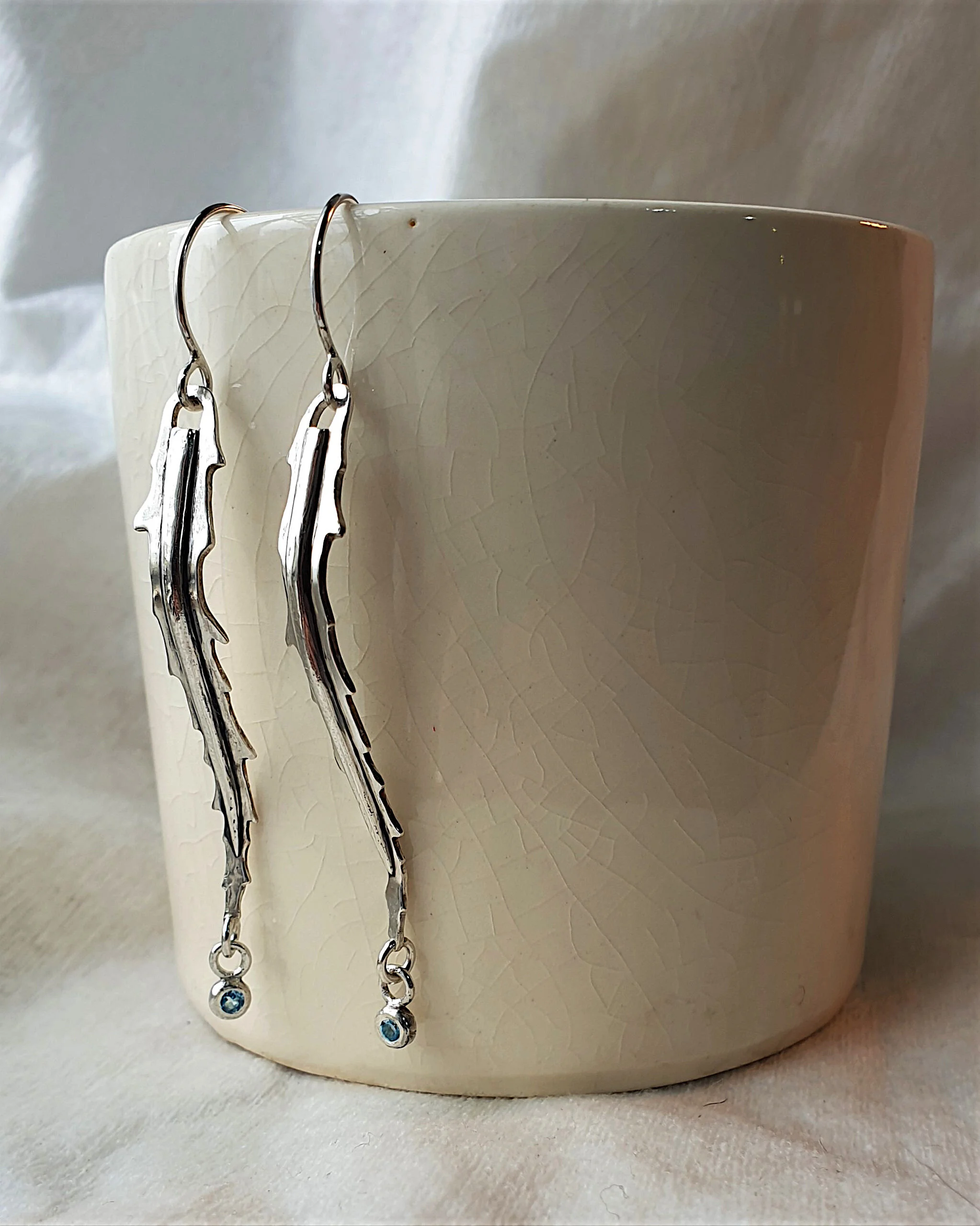 Customized Lancewood earrings with swiss topaz