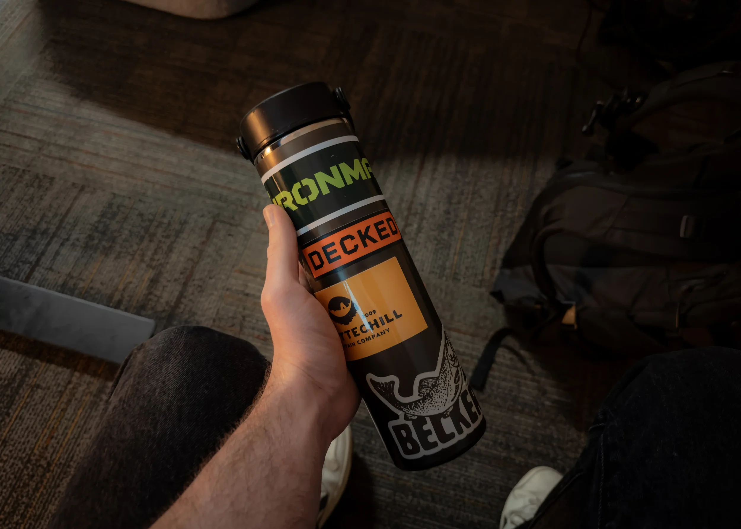 Brown hydroflask trail series water bottle with stickers