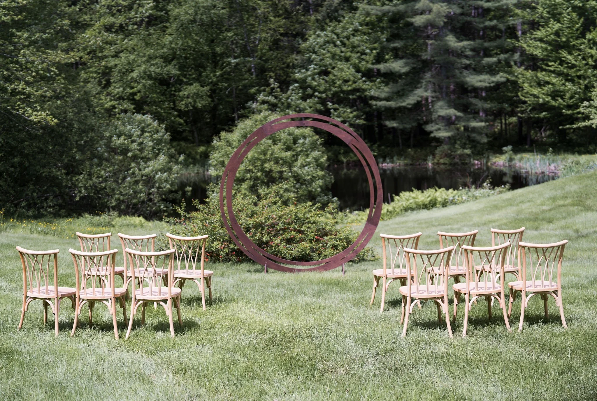 Vermont outdoor wedding ceremony wedding rentals: backdrop and chairs