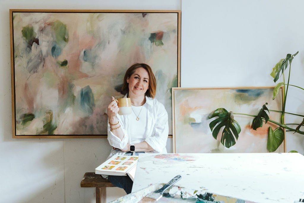 Artists Beth Elsdon in her studio amongst her paintings
