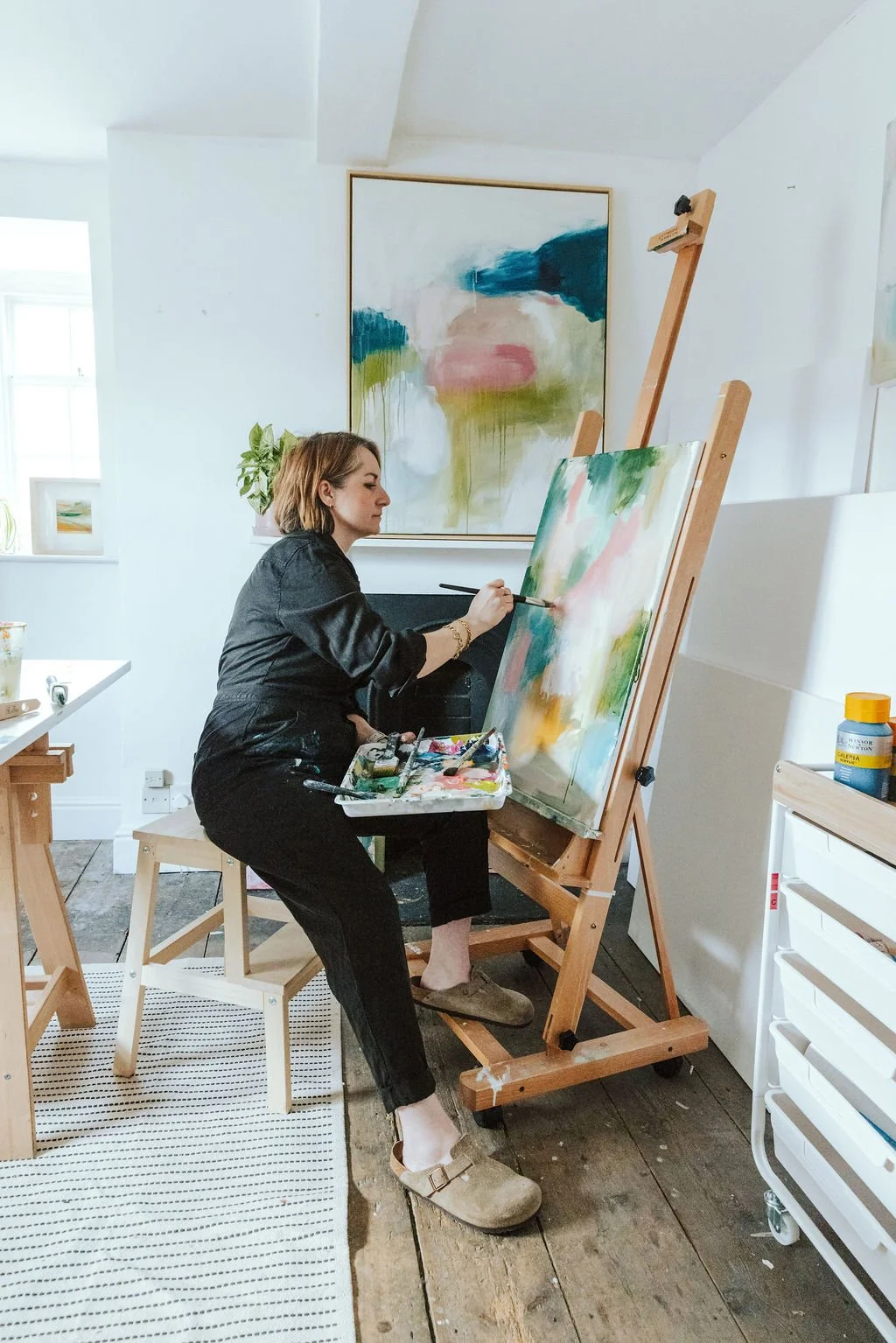 Artists Beth Elsdon painting in her Tadcaster Studio