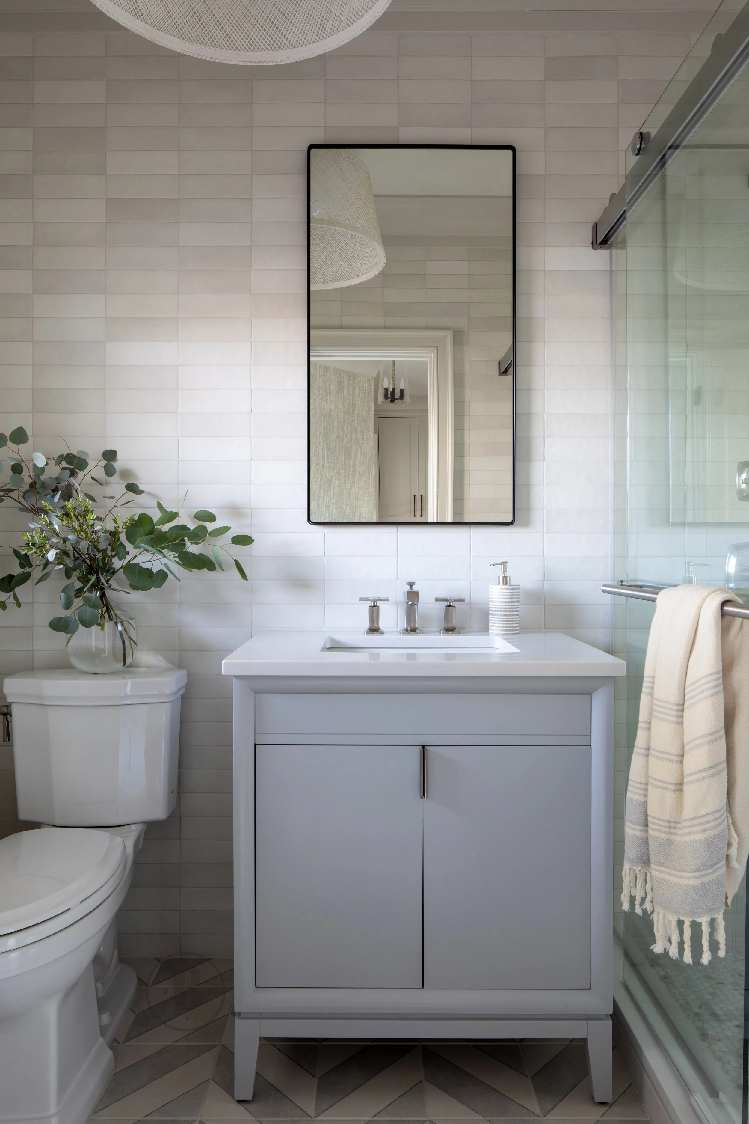 First floor full bath with single vanity and shower