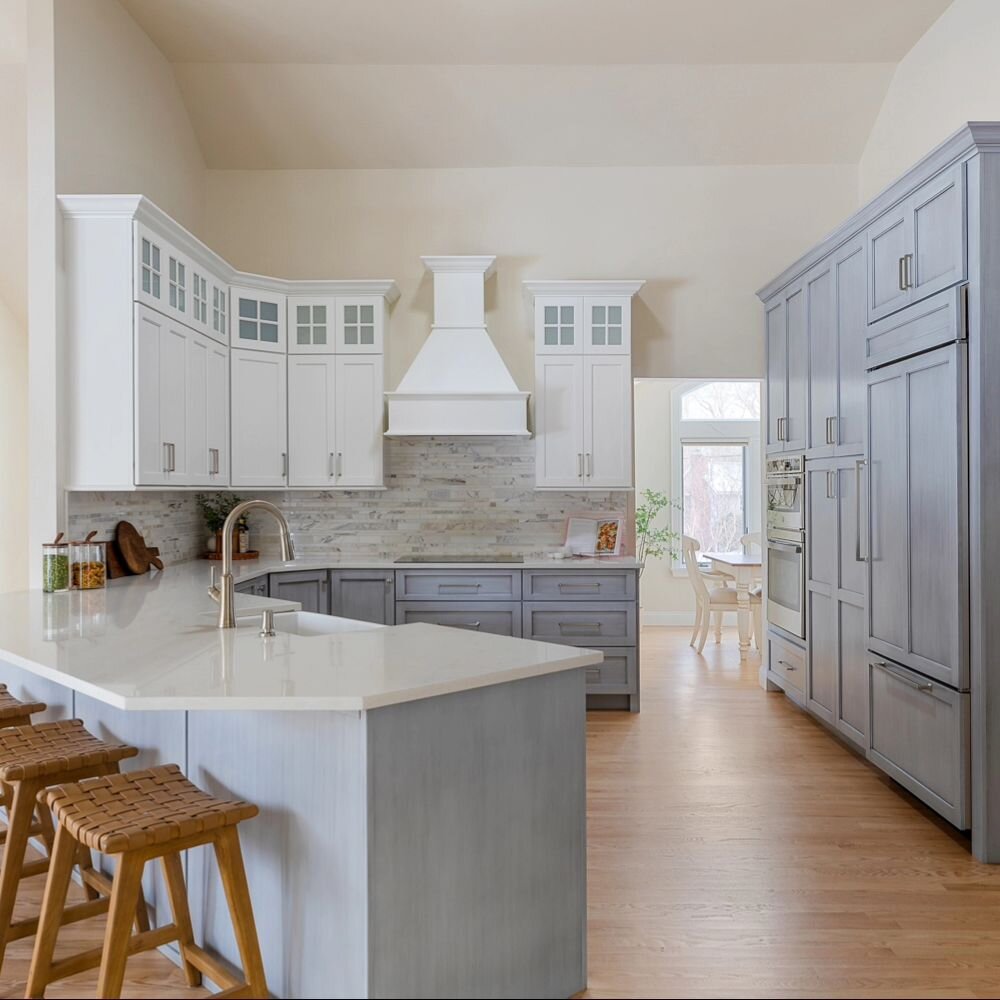Talk about open concept! Even our almost 9ft tall cabinets look standard with these vaulted ceilings!

Our clients love their new beachy kitchen! Would you choose blue cabinets? What color is your dream kitchen?... Take our poll!

Our recently comple