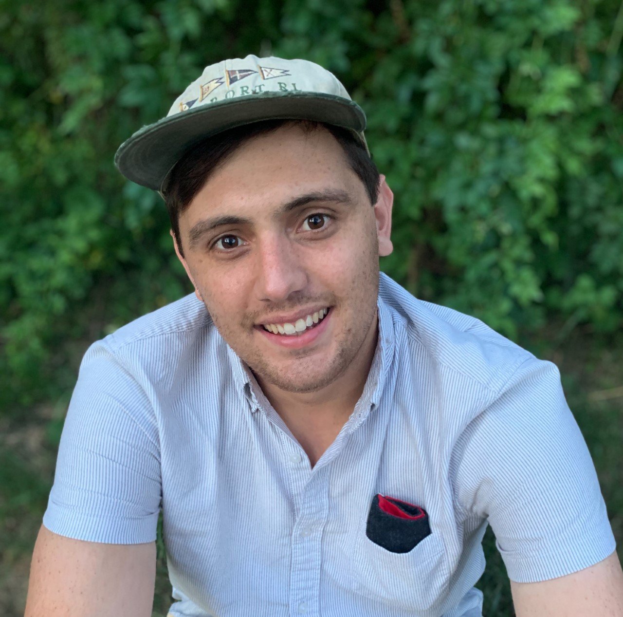photo of Matt in a baseball cap and blue shirt