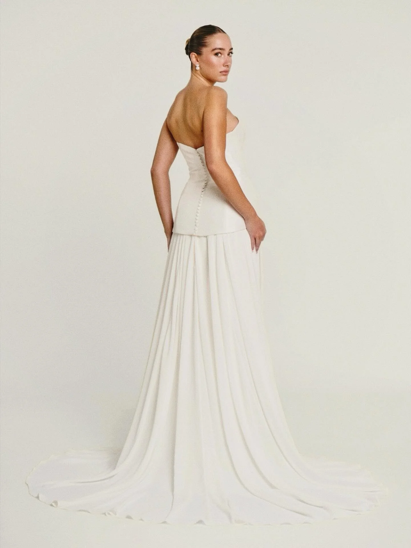 The ever so stunning Margarita gown by @curatorthelabel 
This style featured a dropped-waist mikado bodice and waterfall effect chiffon skirt and train π€
Margarita is available at our amazing stockists, linked in bio.