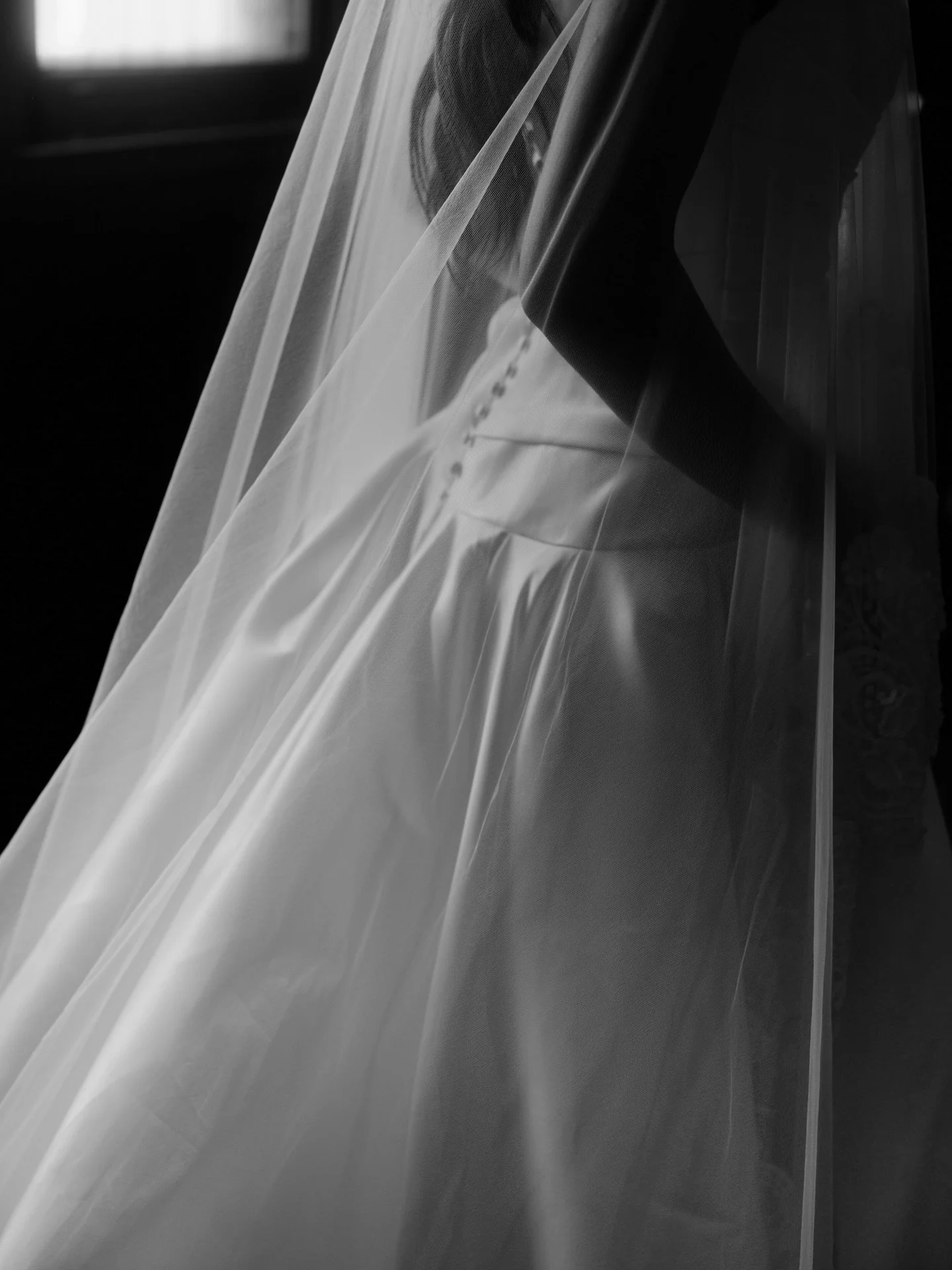 Romantic details captured up close, subtle button details complete the look on our incredible Evie Gown. 

Pictured with our delicate veil, creating opulence through this lightweight, sheer fabrication to complement your bespoke wedding gown.