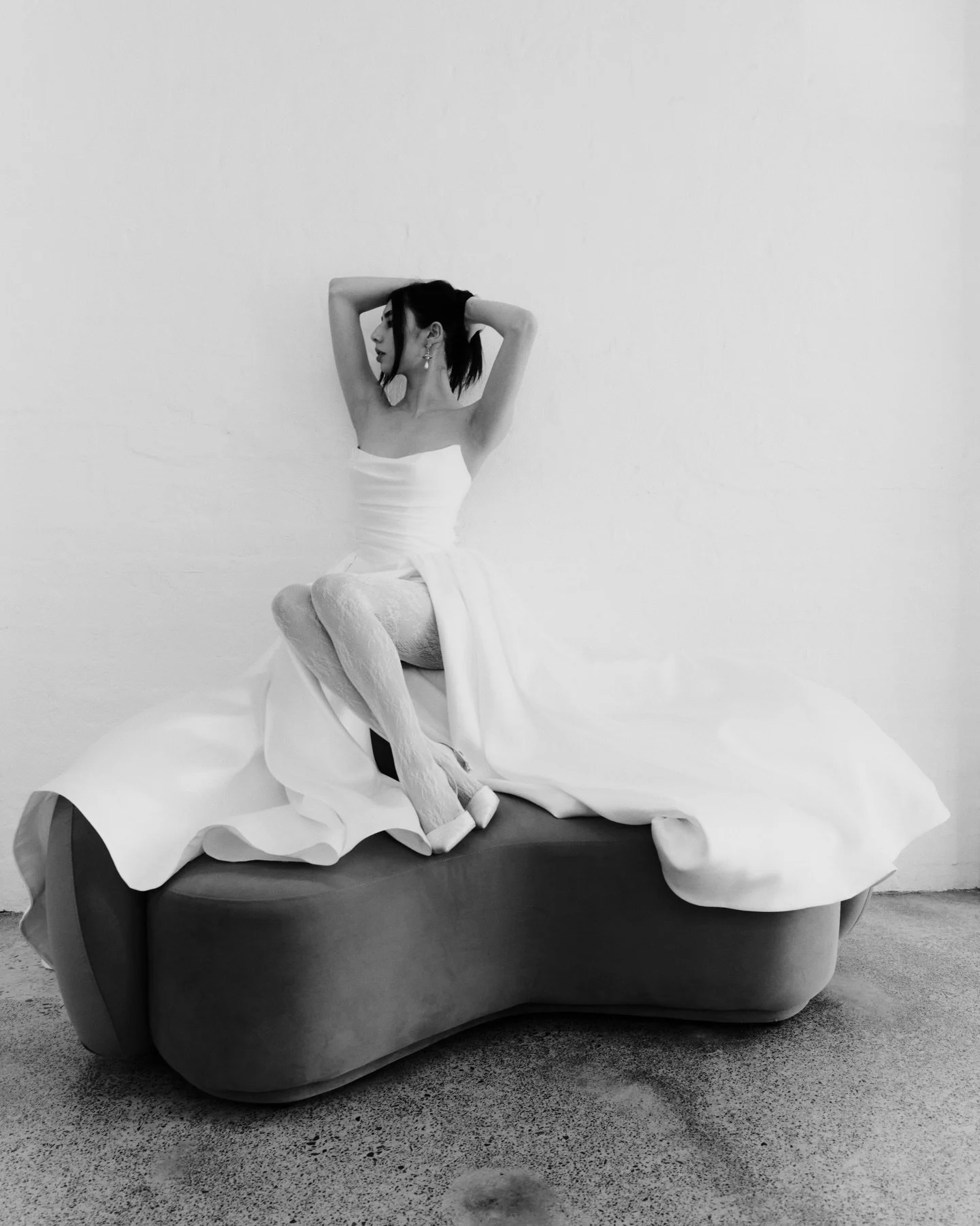 Sleek, sculpted, and full of volume. The Arianna gowns&rsquo; subtle details create a romantic and modern feel. 

This style features a mid-rise basque waist, bodice draping, and a leg slit to show off your shoes x

Available in Melbourne and Sydney.