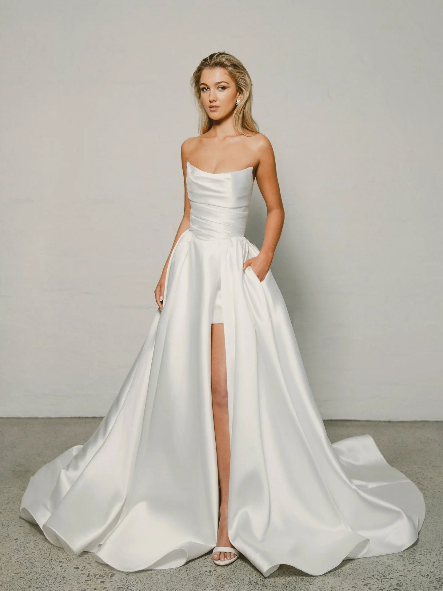 Lustrous and glistening mikado, Arianna showcasing a glam and voluminous bridal look in this elevated a-line style. 

Available at our Melbourne and Sydney stockists.