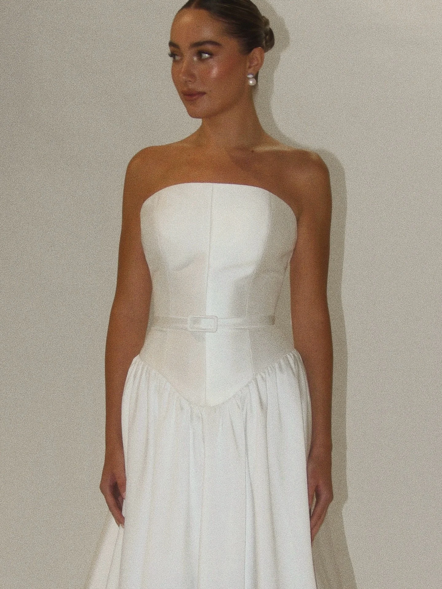 A modern take on a classic feel, the Maia Gown showcasing an elegant dropped basque waist silhouette and soft a-line skirt.