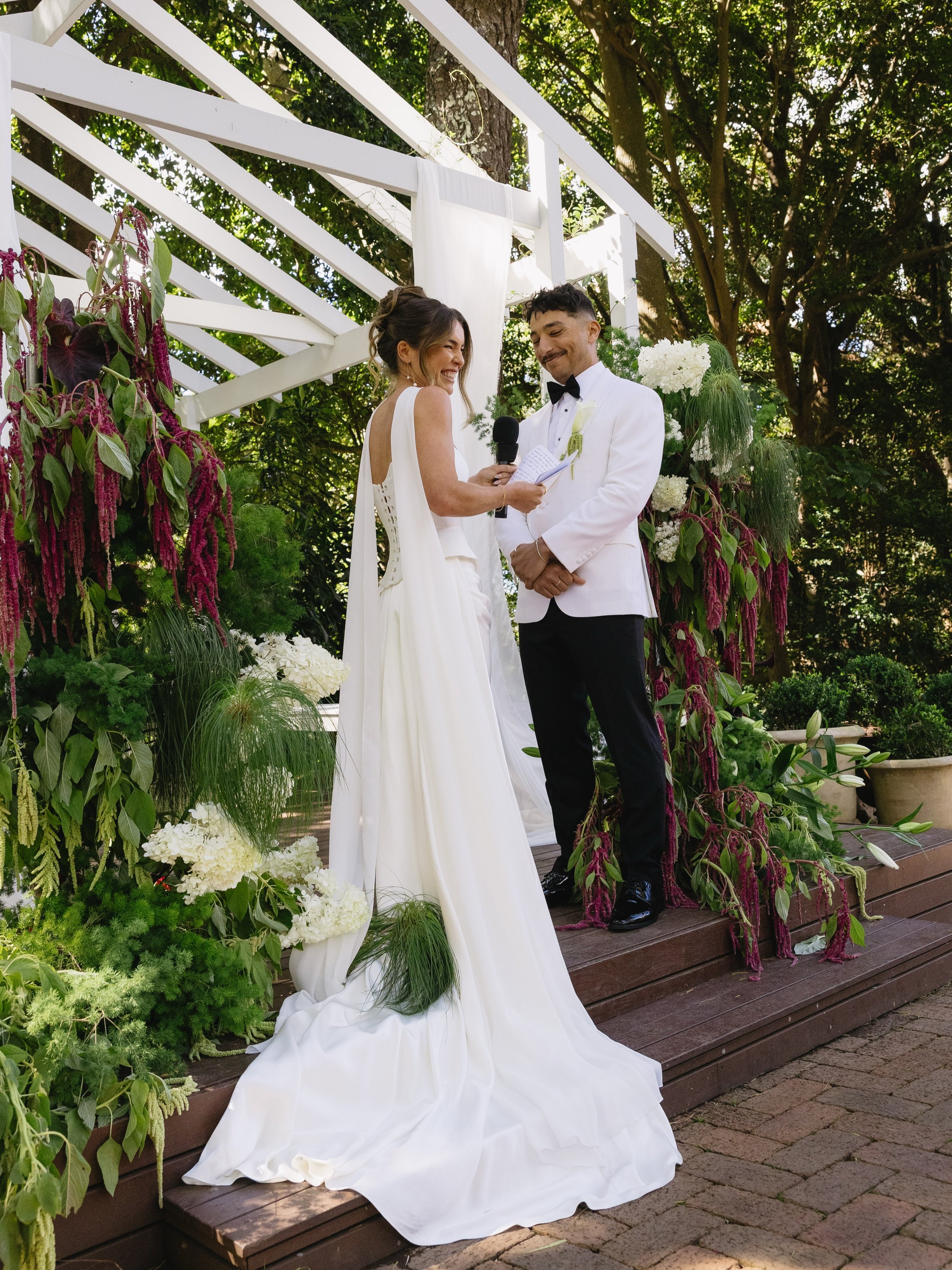 Curator The Label, with elevated accessories. 

Bride Madeleine completed her bridal look with a bespoke, lightweight chiffon scarf for the final touch.