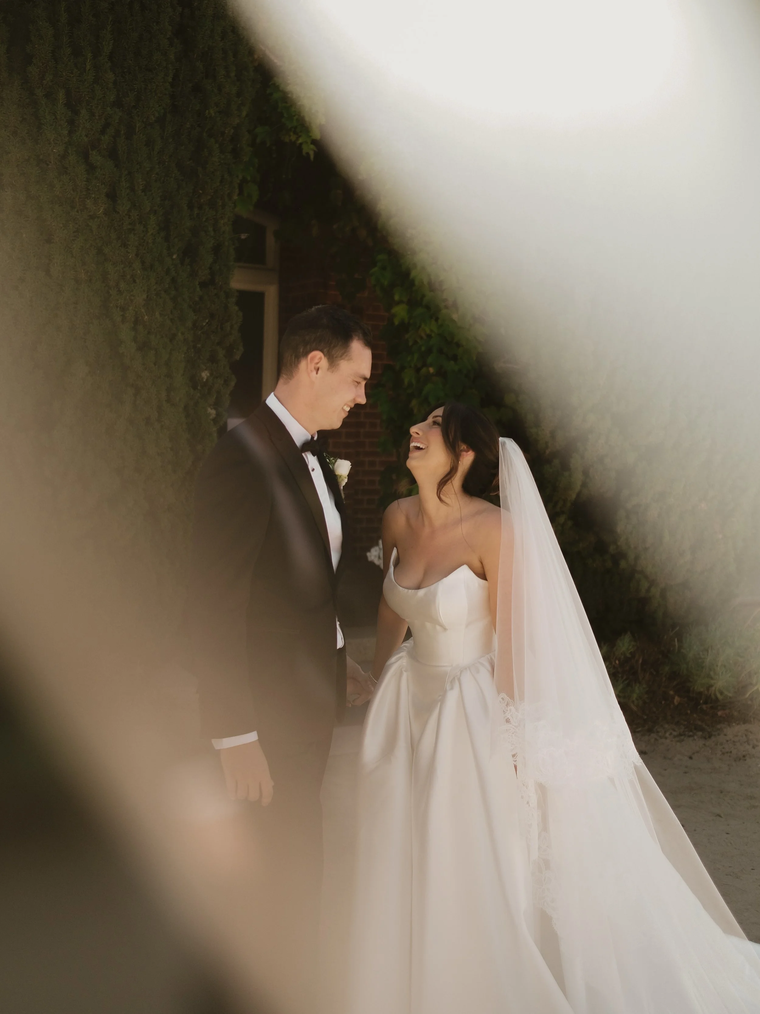 Details of the next chapter, captured at the wedding of Alarna and Daniel. 

Alarna is pictured, spending moments in time in her bespoke Madeline Gown. 

This gorgeous style is available to try at our stockists in Melbourne and Sydney.