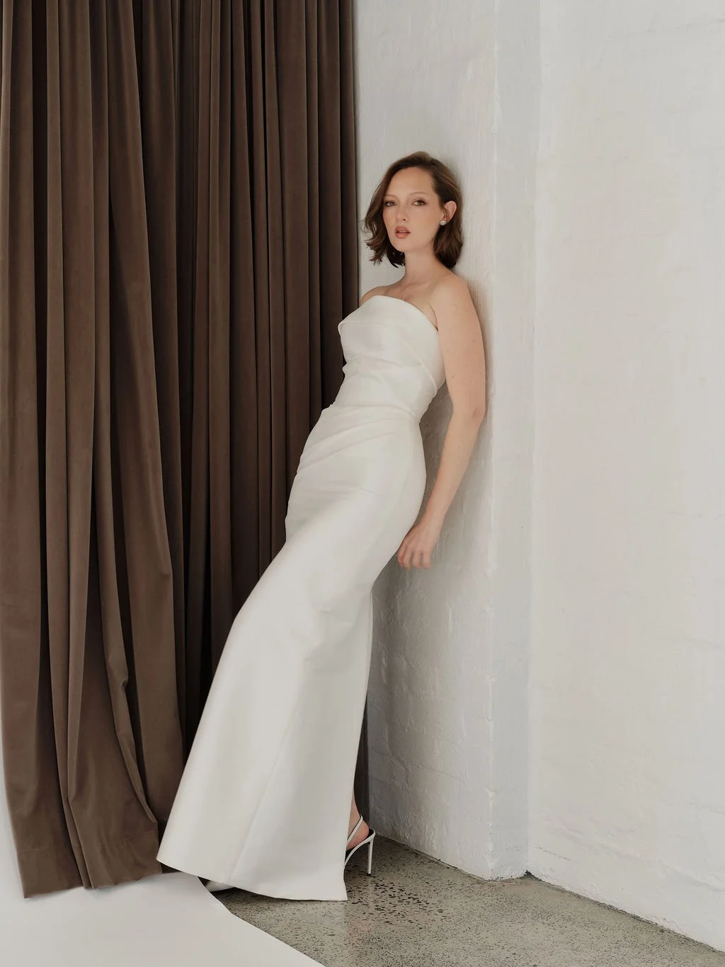 Eloise has a modern, understated bridal aesthetic, the gown is refined, sophisticated, and ideal for a bride drawn to clean silhouettes and subtle sculptural details.