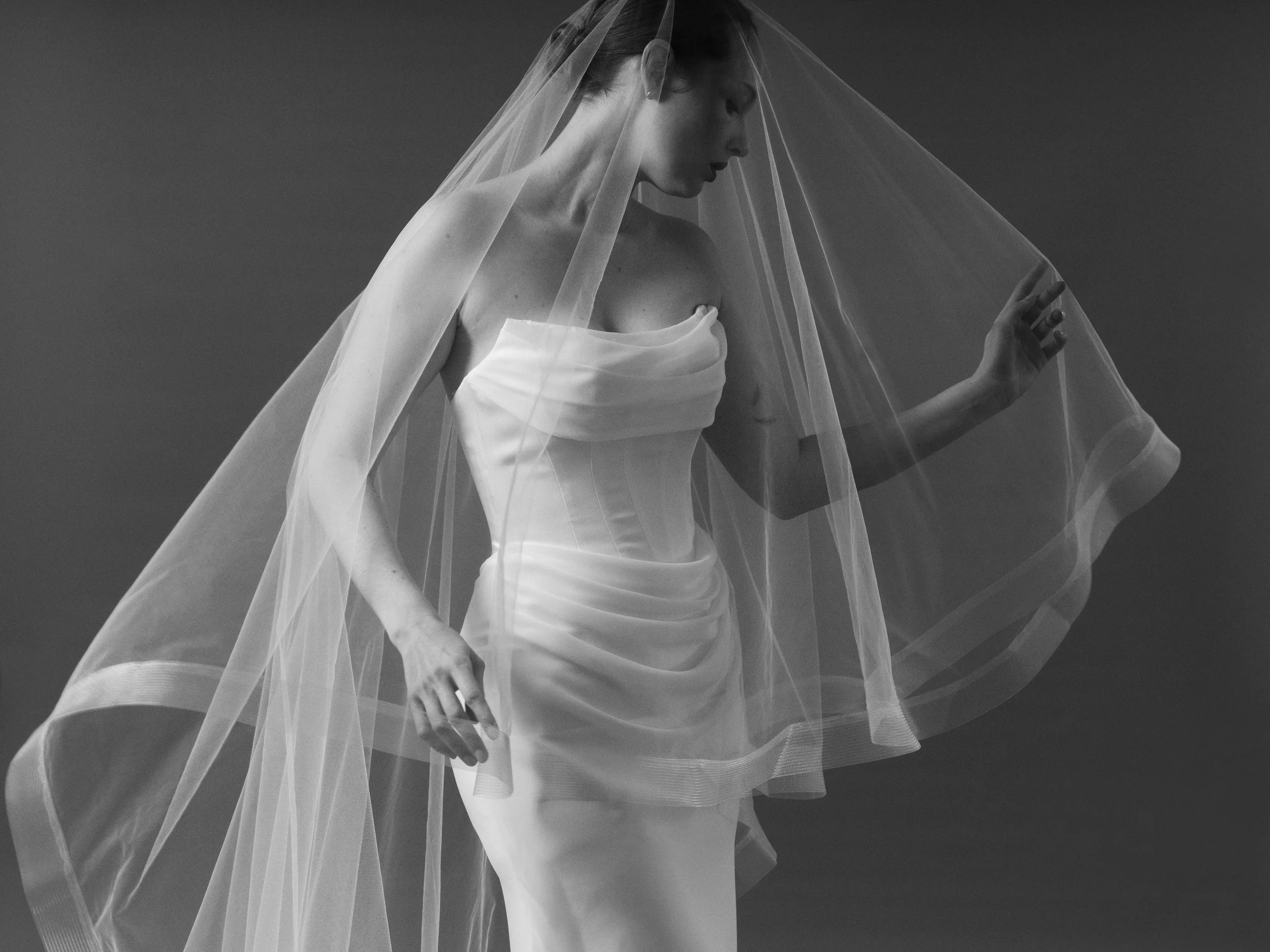 A cathedral-length veil in weightless tulle, designed to move, frame and transform. Ethereal in feeling, dramatic in scale and effortlessly modern.
Because sometimes the final layer makes the entire look. Discover Epona by Curator The Label featured 