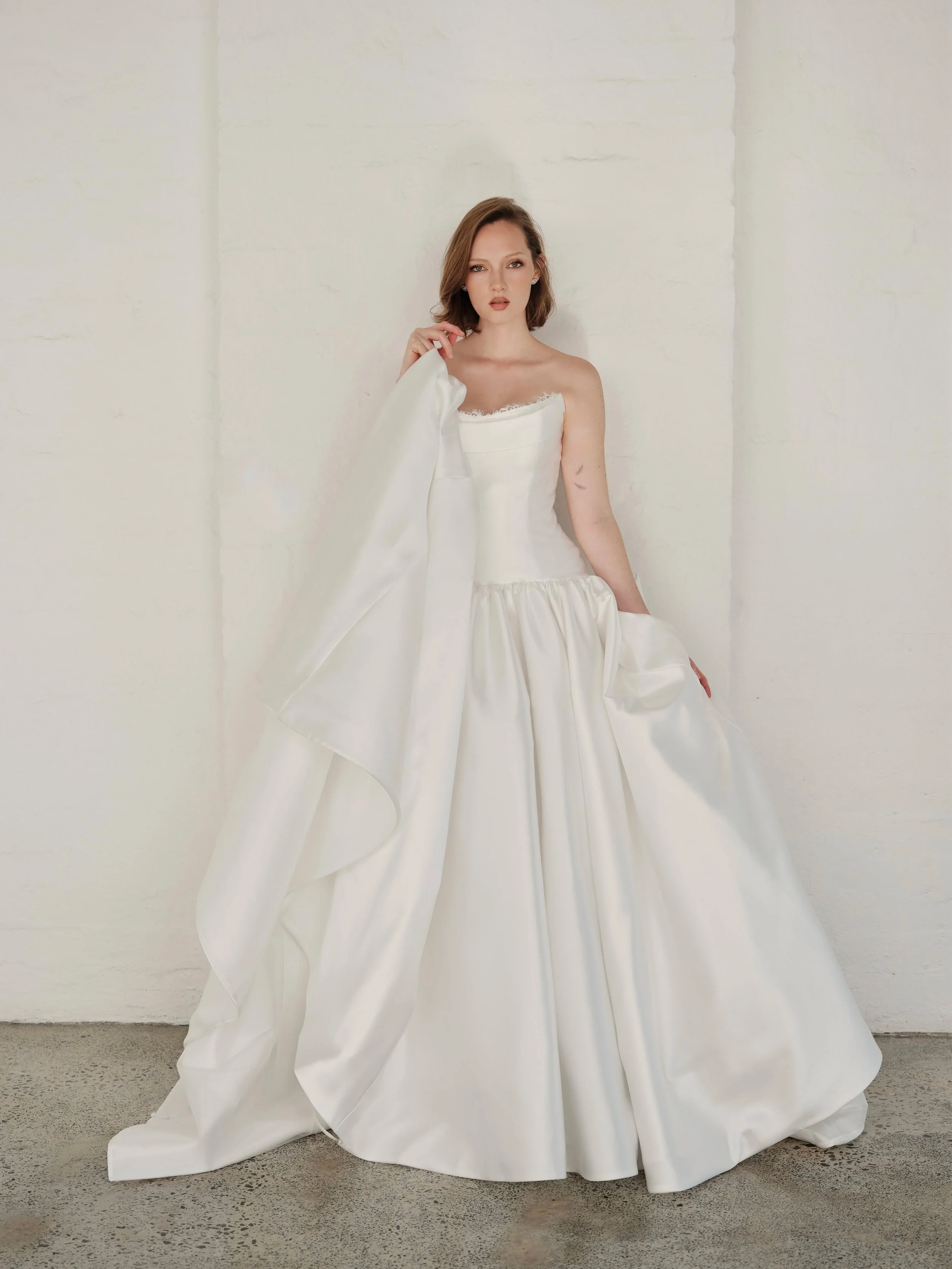 Romance, reimagined that is unapologetically feminine. Modern bridal with an old world soul. Introducing the Despina gown
