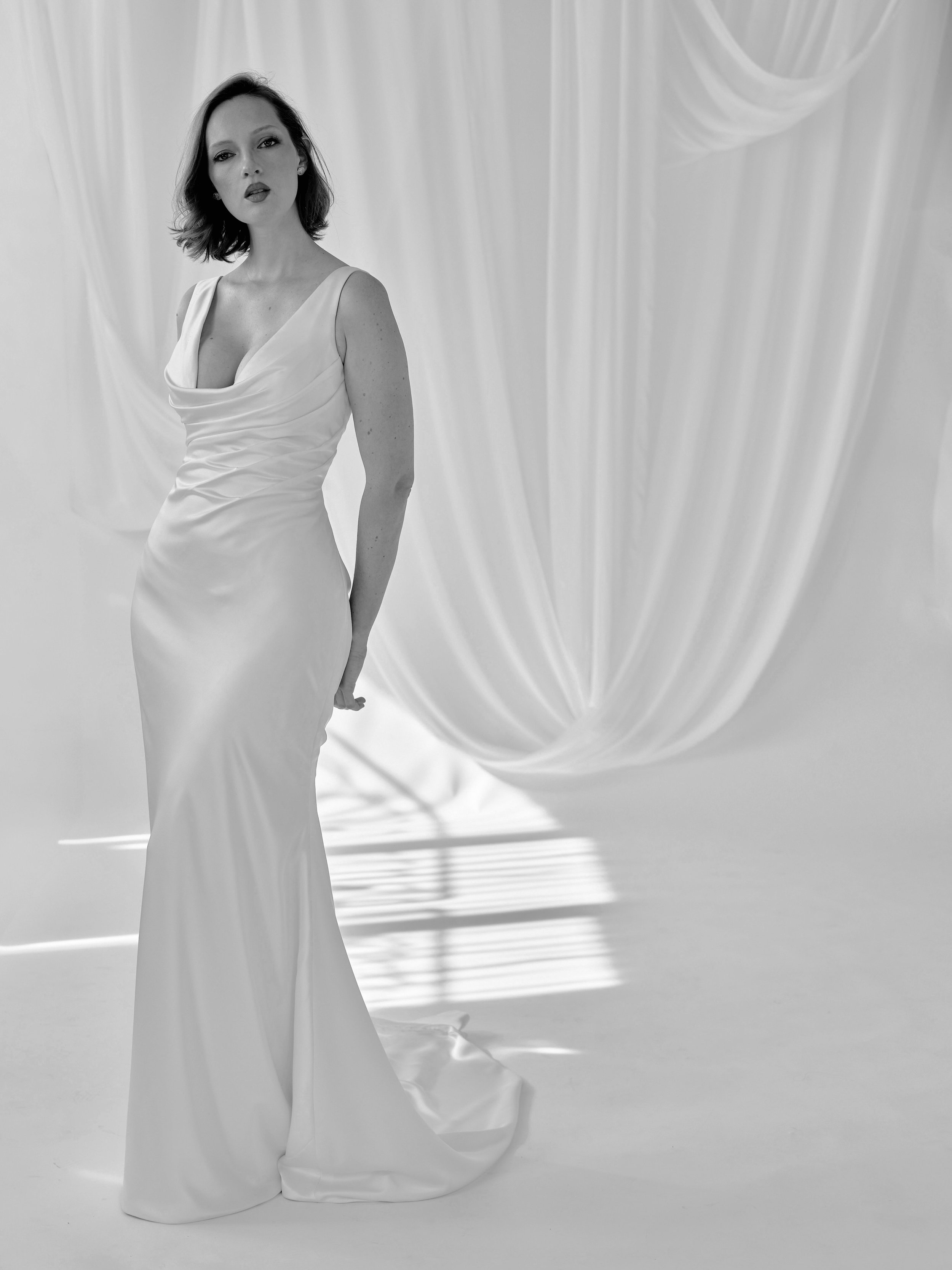 Chloe.

Effortless, understated, and impossibly chic. Cut in fluid satin with a softly draped cowl neckline and sculpted ruching through the bodice, Chloe skims the body with an ease that feels both modern and timeless.

Minimal, but never simple. Th