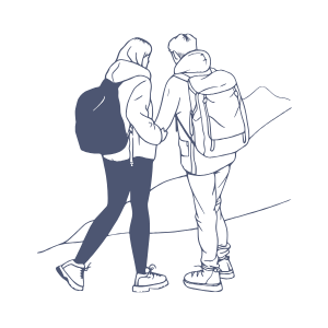 Two hikers with backpacks walking on a mountain trail.