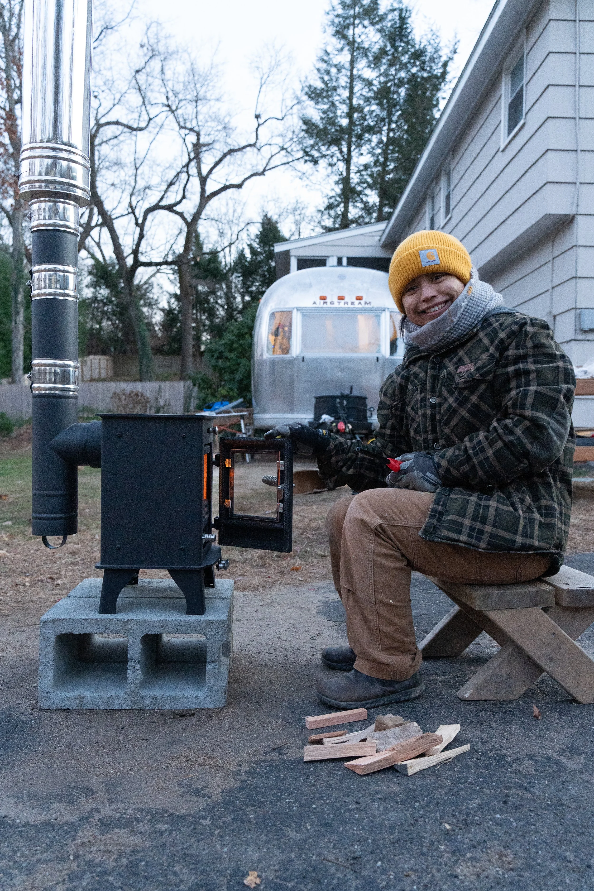 Doing an outdoor burn for a tiny wood stove installation in an airstream trailer