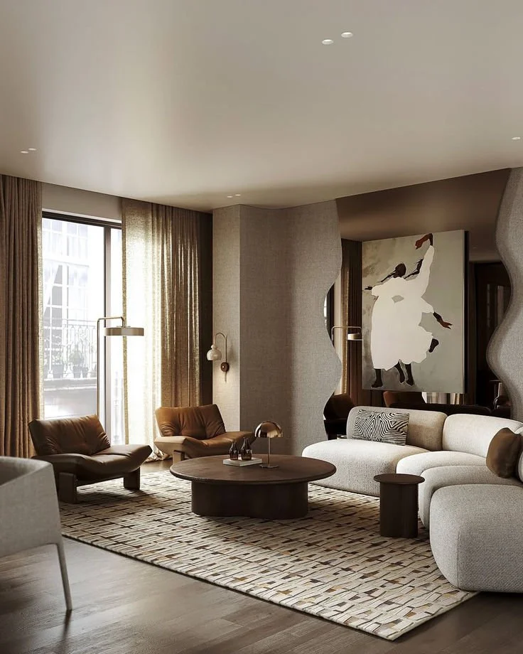 “Luxurious Parisian-inspired living room with grand antique mirror, crystal chandelier, elegant panel molding, and neutral-toned modern sofa décor”