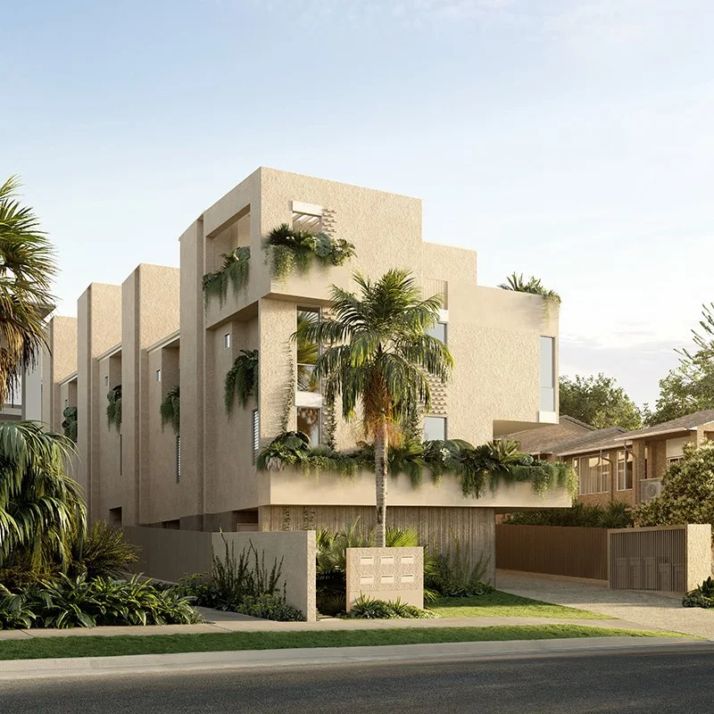 Modern beige multi-story building with lush palm trees and greenery in front and on balconies, clear sky in the background.