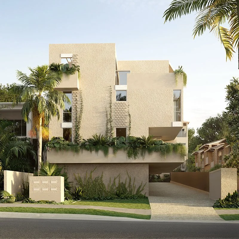 Modern beige residential building with lush greenery and palm trees in front, driveway leading to garage, and a blue sky background.