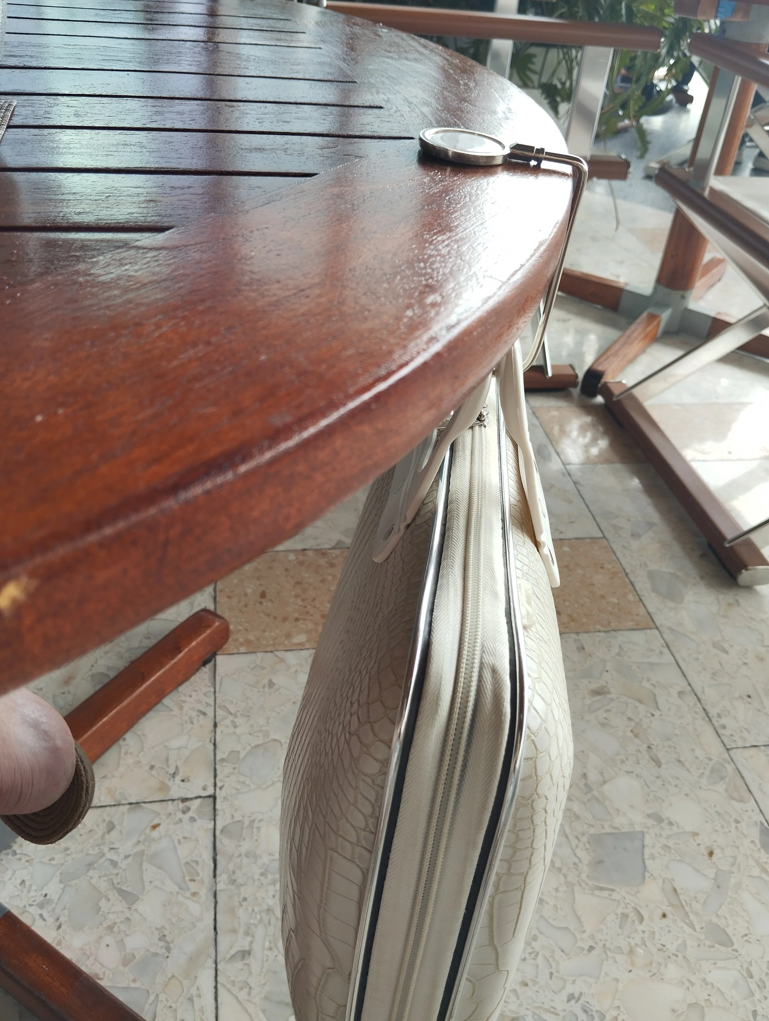 Let me share something with you... 

A few days ago, I was working from Bellini in Coconut Grove.

I had left my bag on the floor beside me. 

A few moments later, a waiter came with a small elegant hook that he attached to the table, so my bag would
