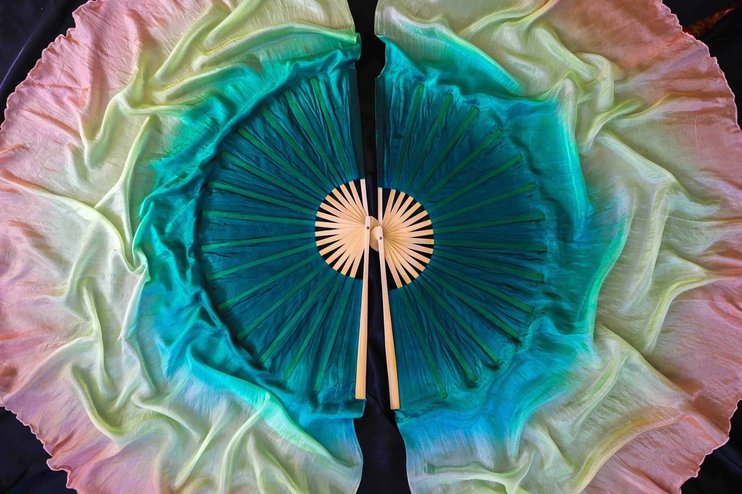 Calypso HalfMoon 100% Silk Fans - Studio Series 

These stunning veils are partially UV reactive on the peach + yellow. 

I will get round to taking UV videos for them soon - but trust me when I say they are ETHEREAL under a black light. 

A few sets