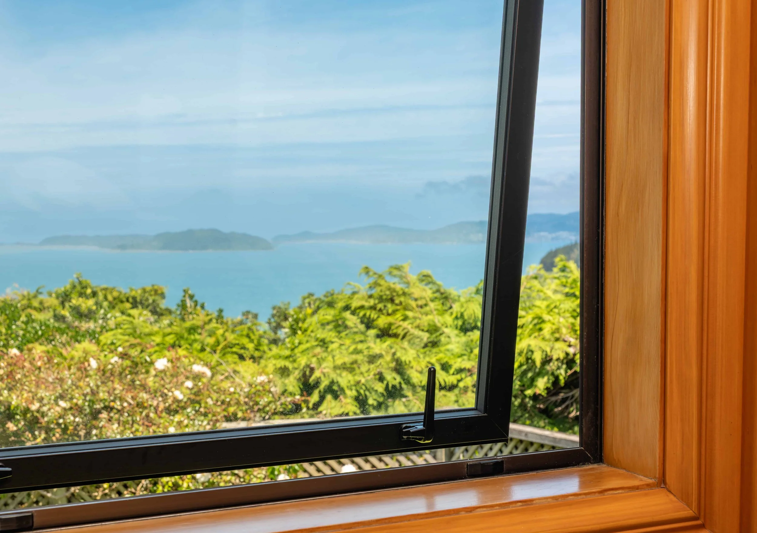 Close up internal view of a double glazed aluminium opening window that Eversure installed. reFIT Ali service