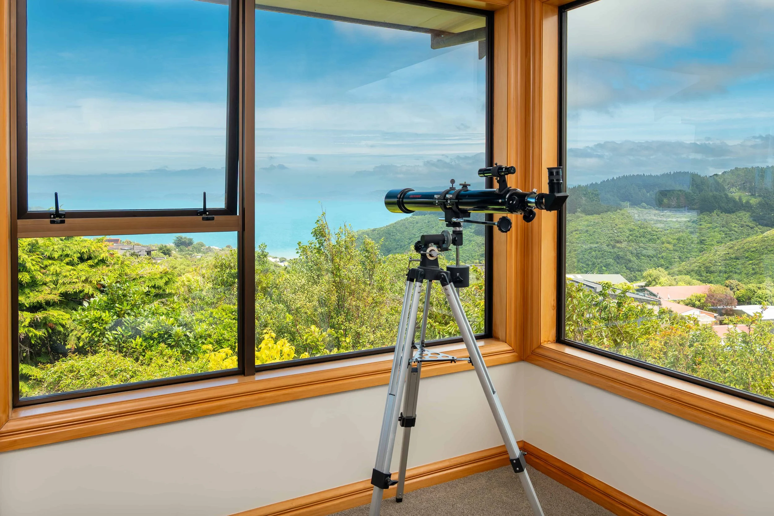 Internal view of 2 bronze aluminium windows looking over the harbour that were double glazed by Eversure.