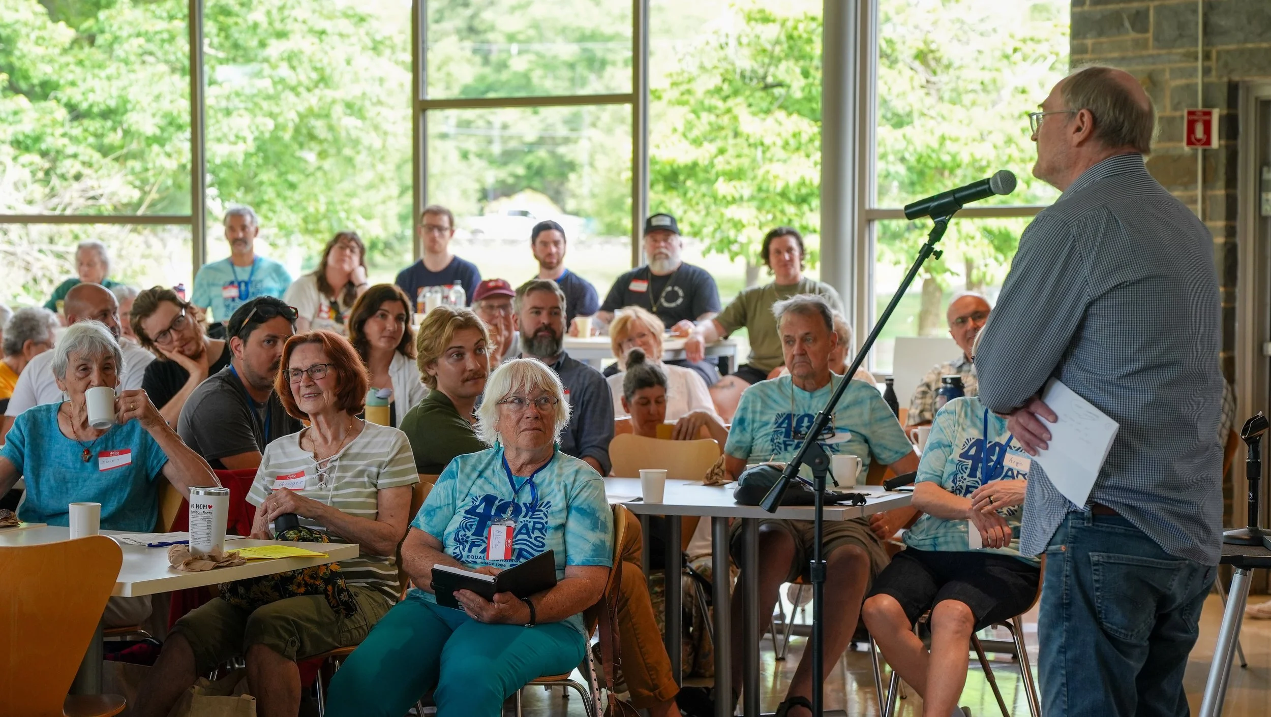 Person speaking in front of audience