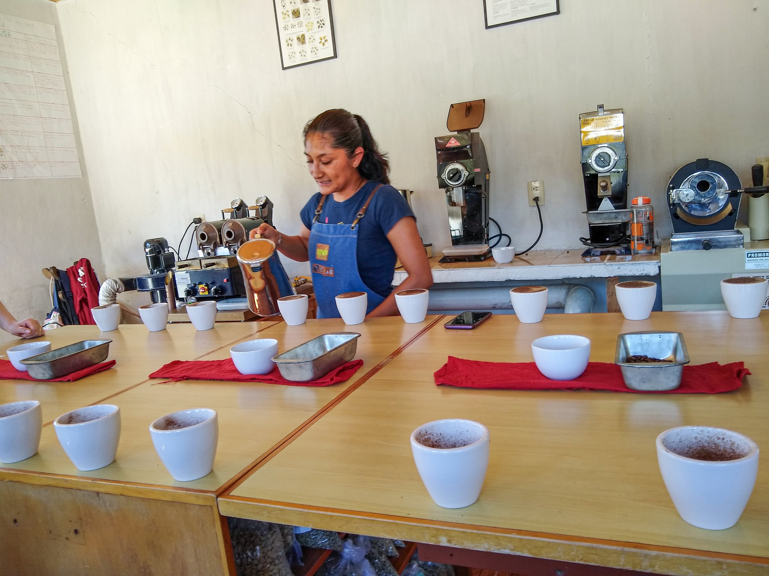 Alejandra Gurgua Ruiz preparing a coffee cupping at Compon Yaj Noptic.