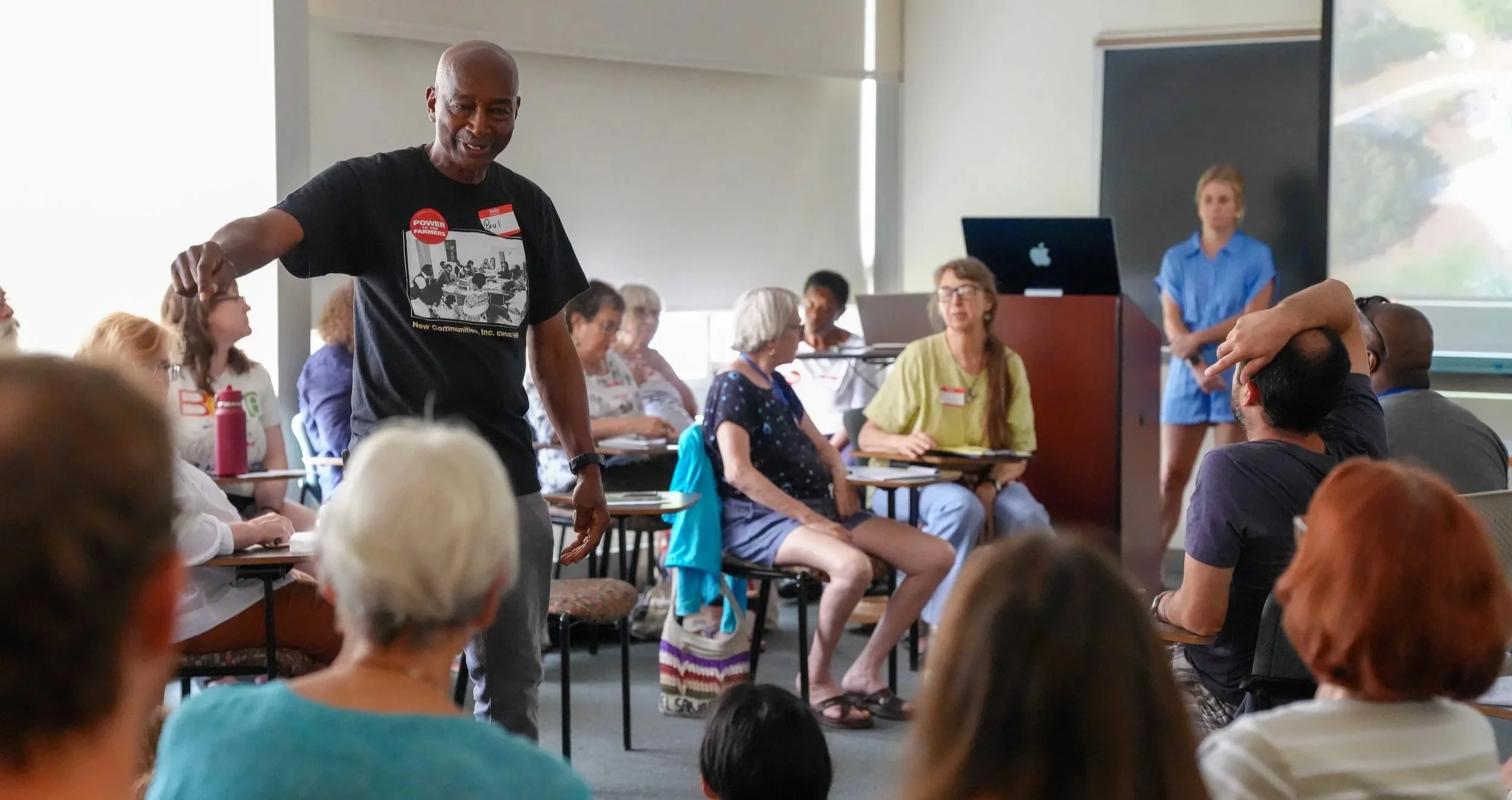 Person talking to group in classroom