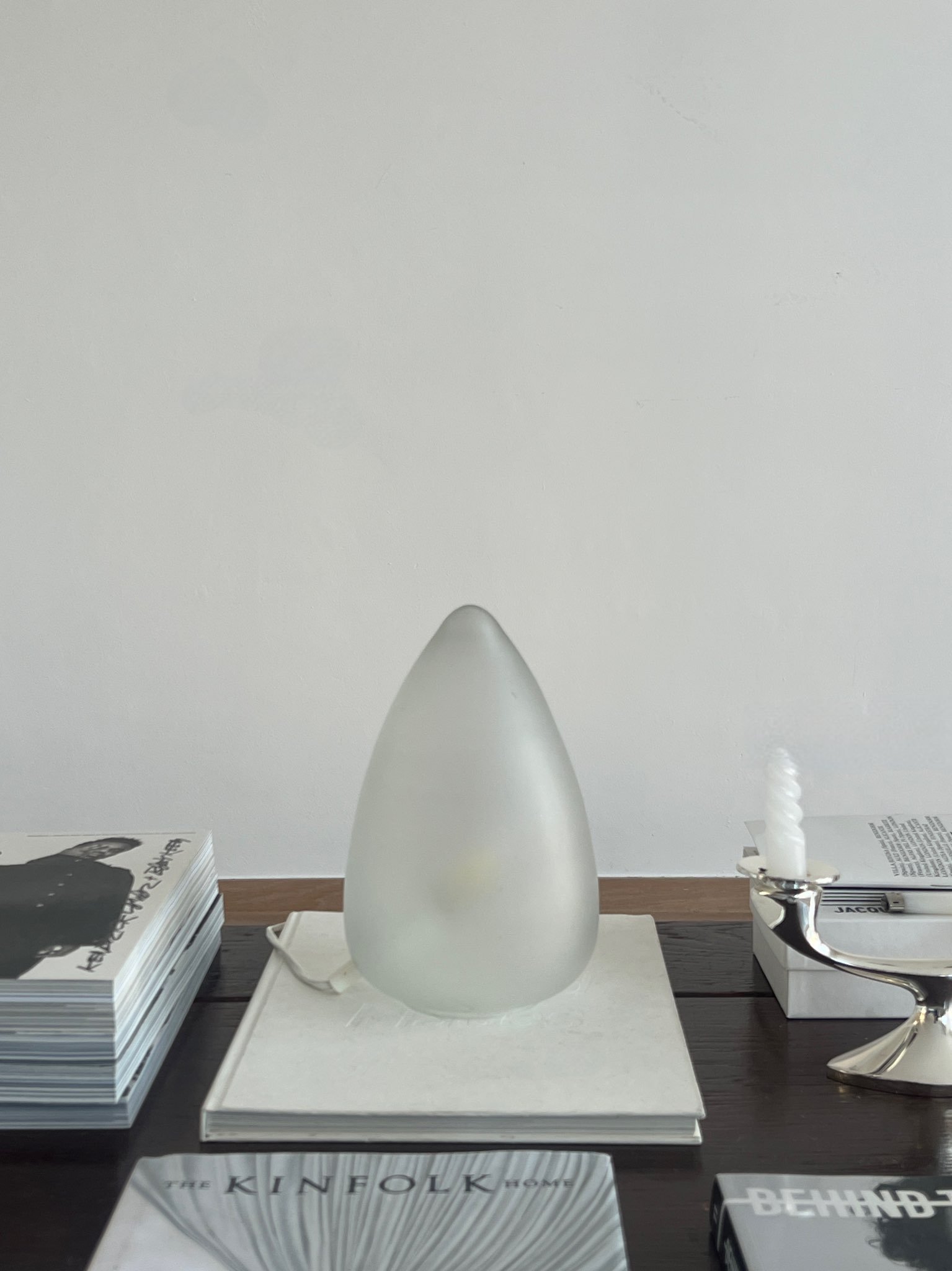 1970s frosted glass lamp with minimalistic design on a coffee table