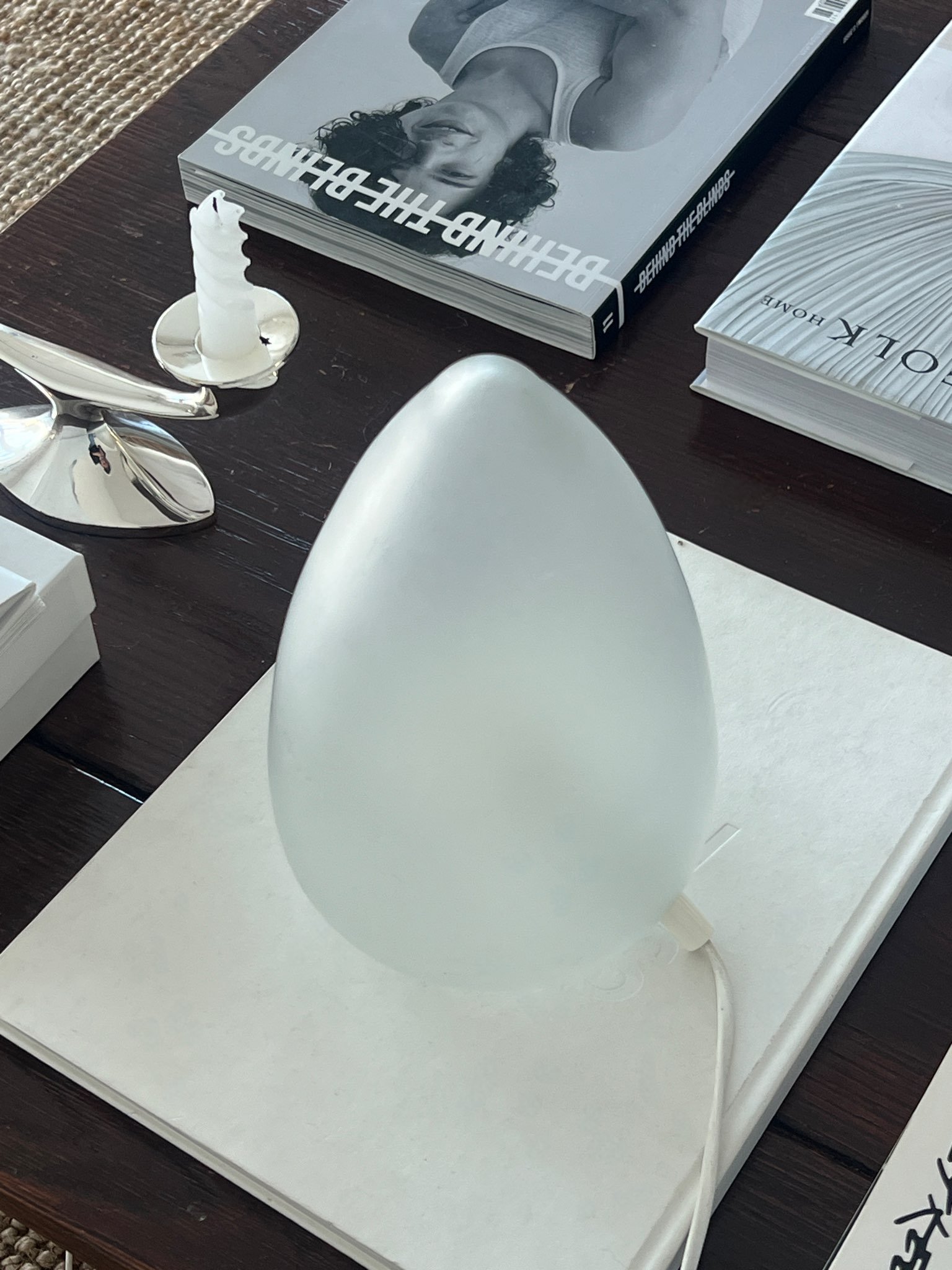 1970s frosted glass lamp with minimalistic design on a coffee table