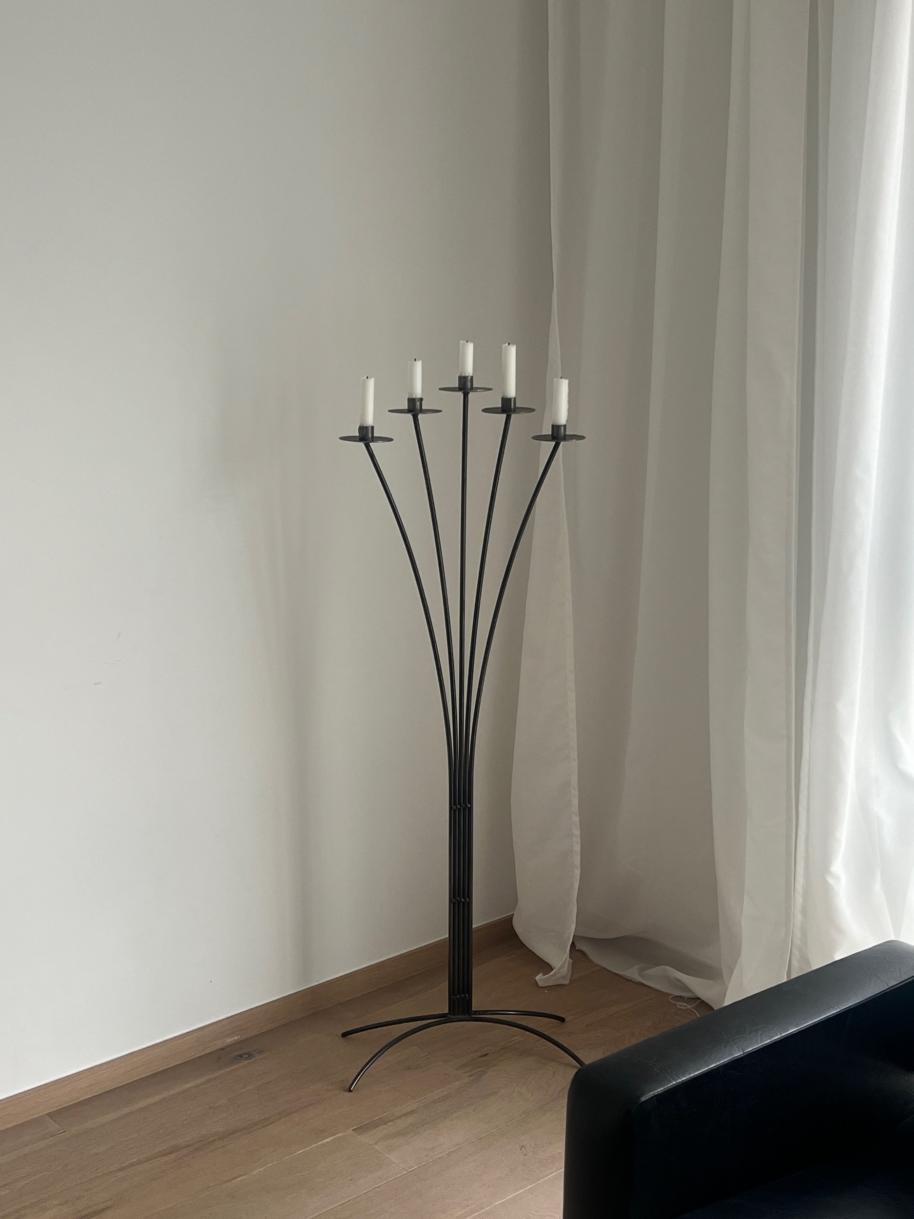 Minimalist mid-century modern black floor candelabra with five candle arms, perfect for vintage and contemporary interiors