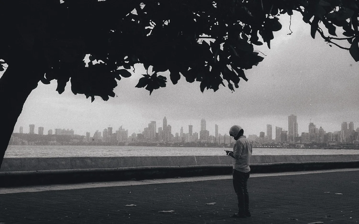 A lone man standing on an empty Marine Drive, Mumbai, during the first COVID wave, shot on a Nikon FM2 on black-and-white film