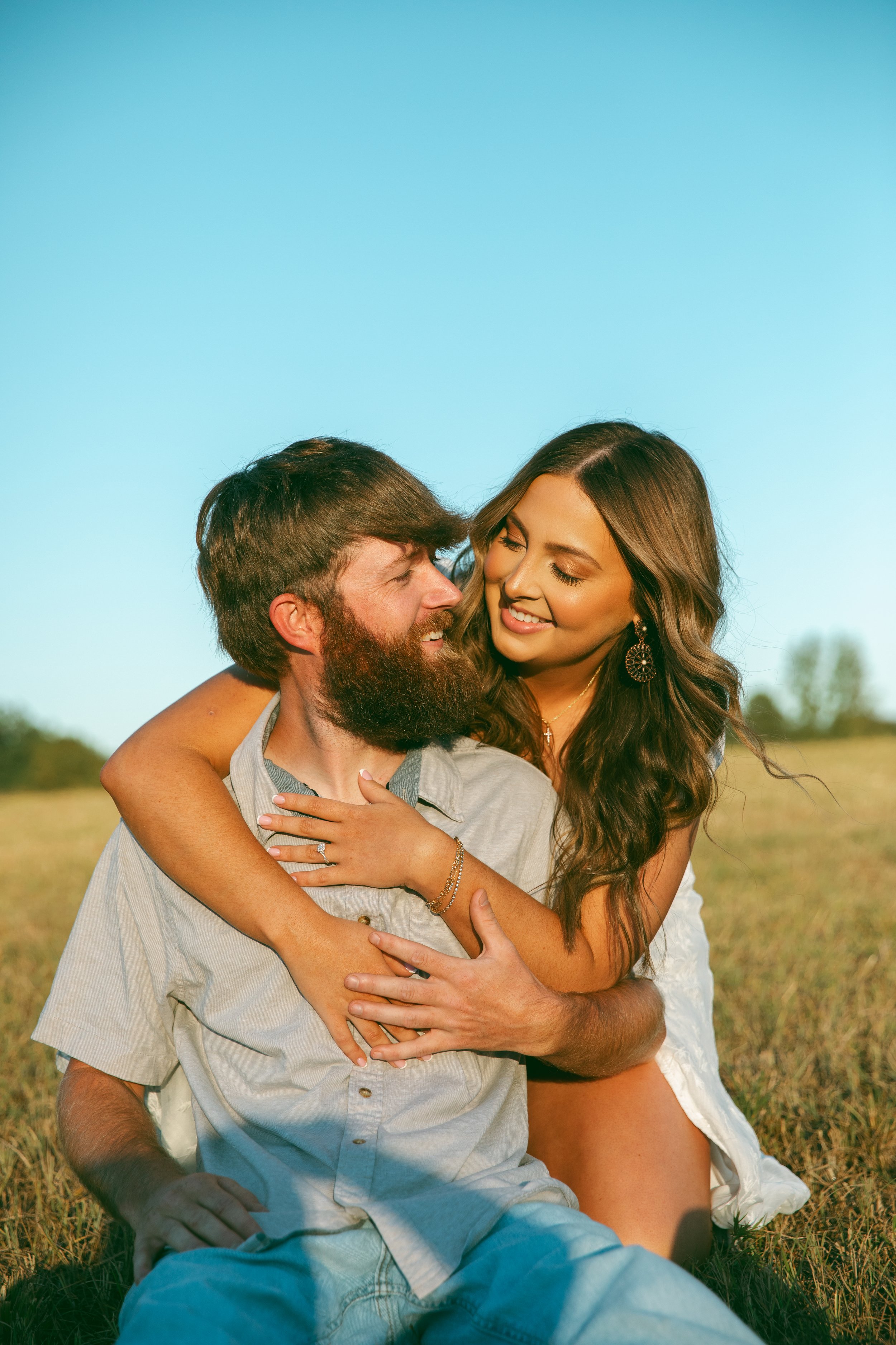 Fun engagement session in a field 