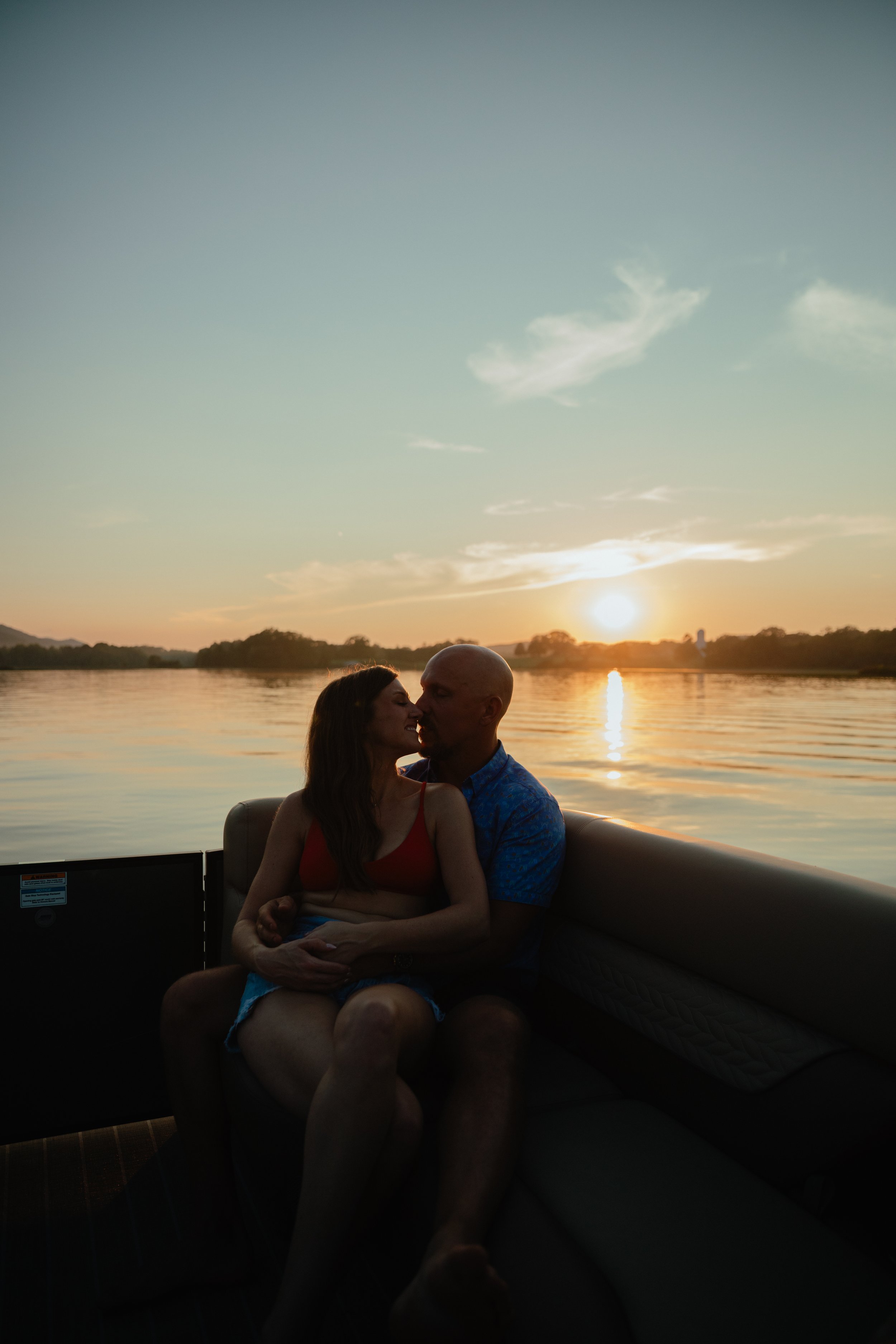 River boat engagement session at sunset