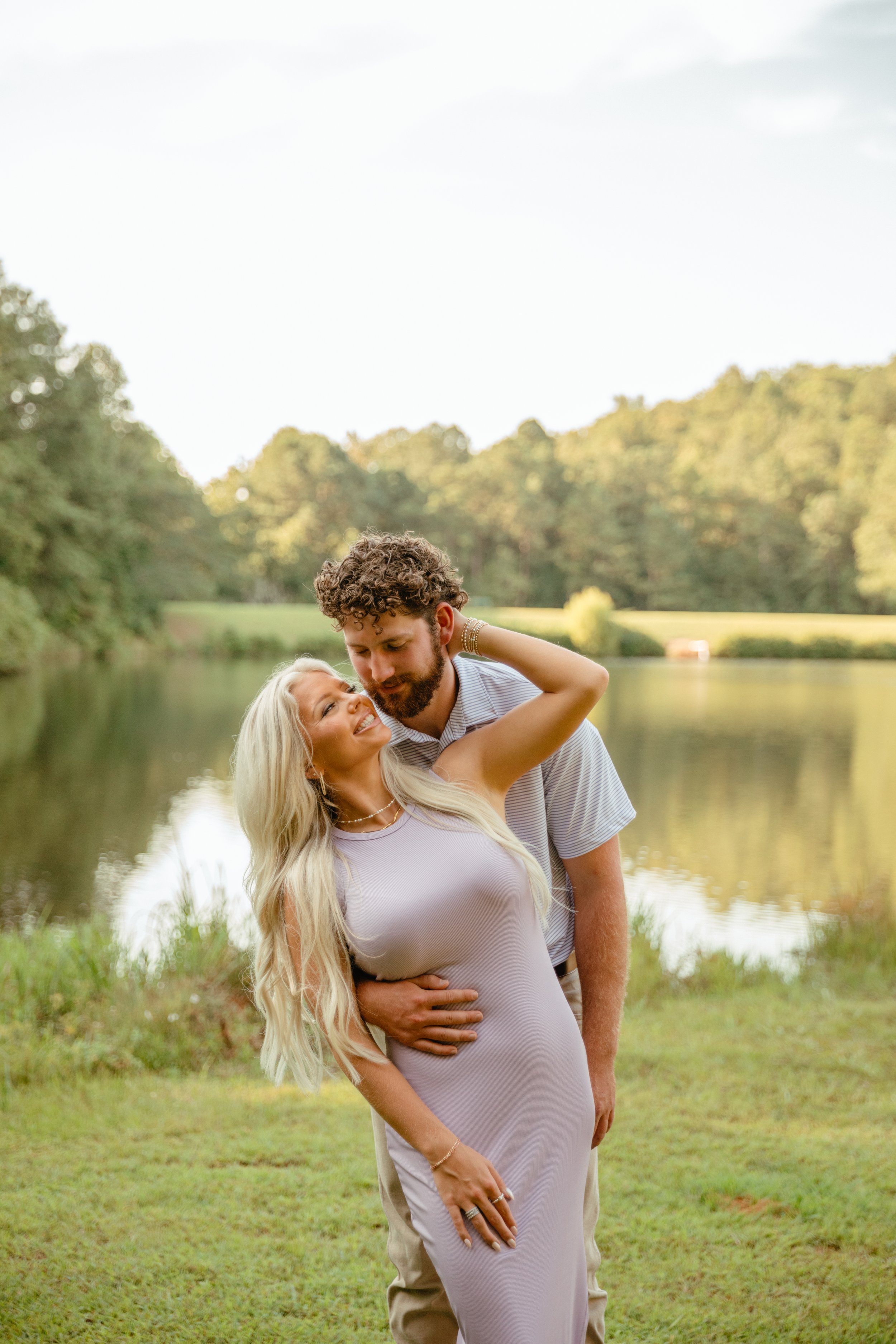 Engagement session in front of a lake in alabama