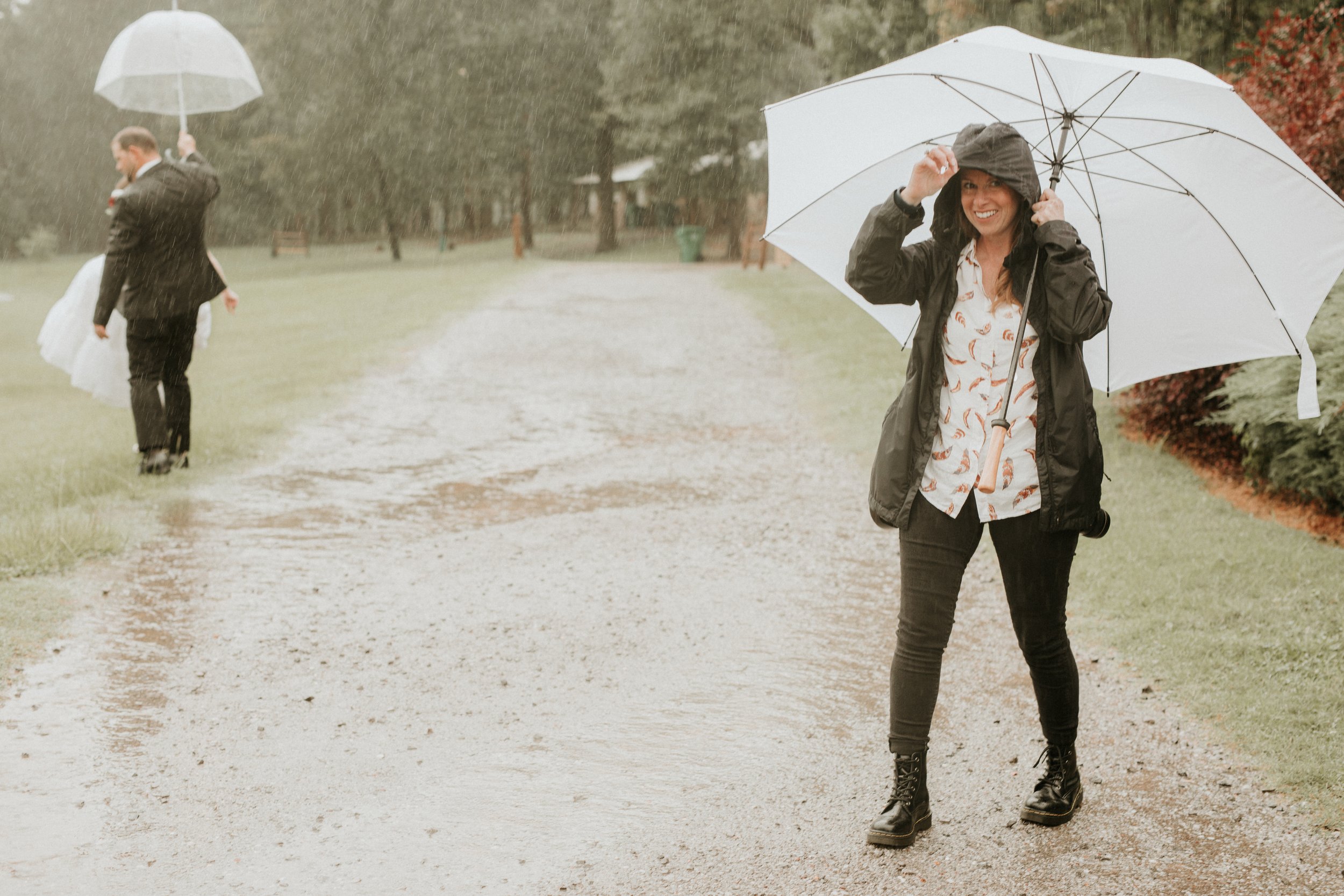 Wedding photographer shooting in the rain 