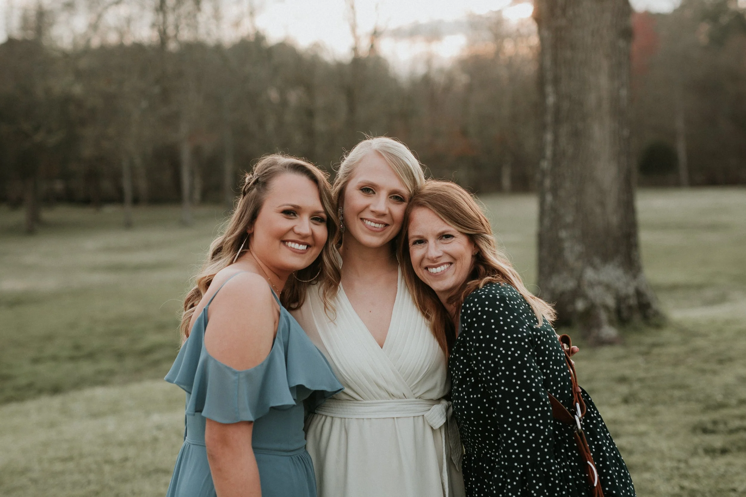 Wedding-photographer-hugging-brides.jpg