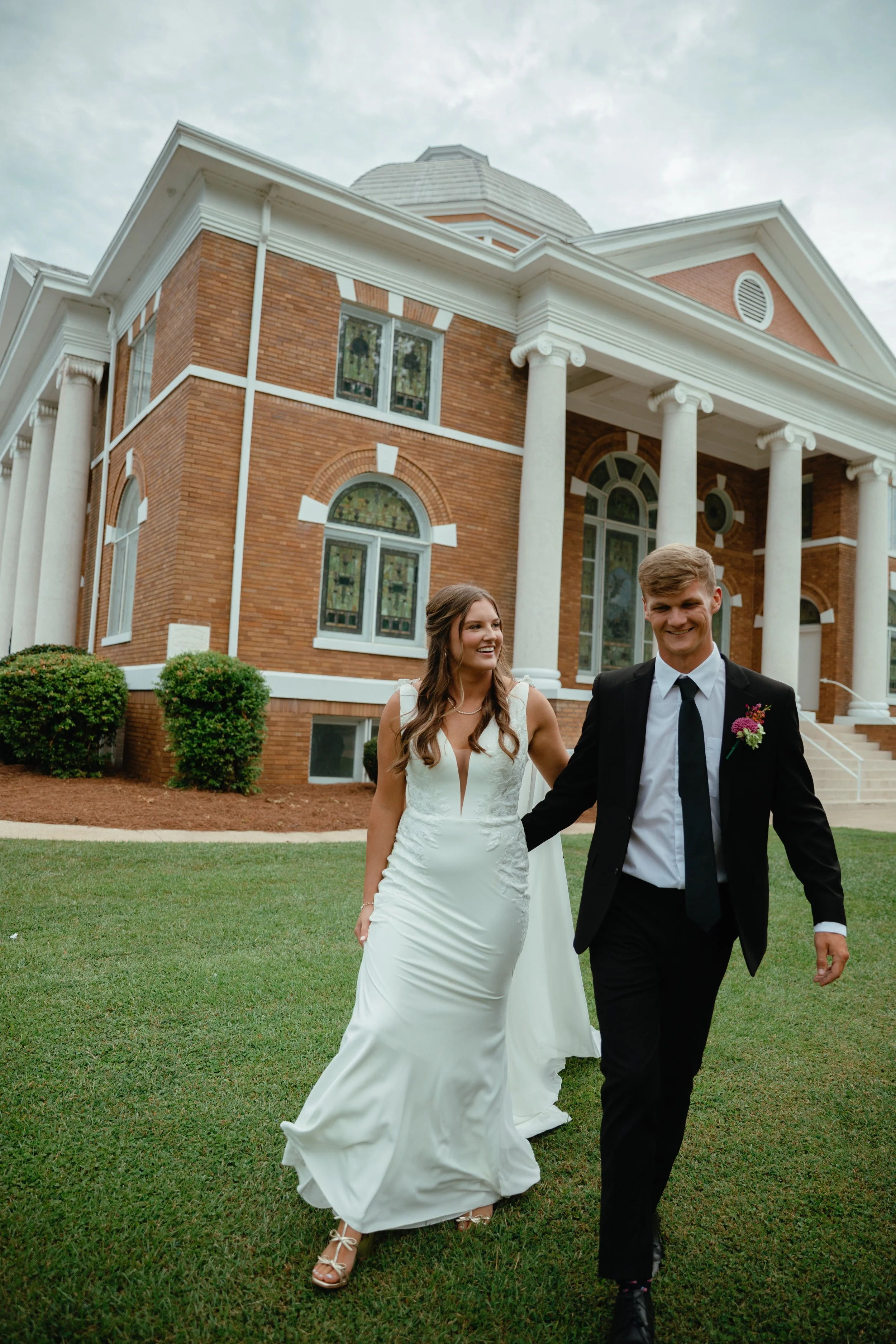 wedding couple walking away from a church wedding columbiana, alabama