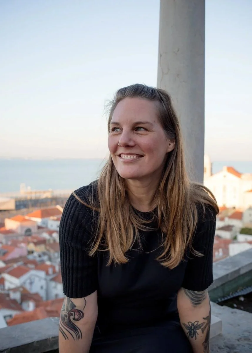 Marga, Ella Travel Portugal advisor, on a Lisbon rooftop overlooking the city.
