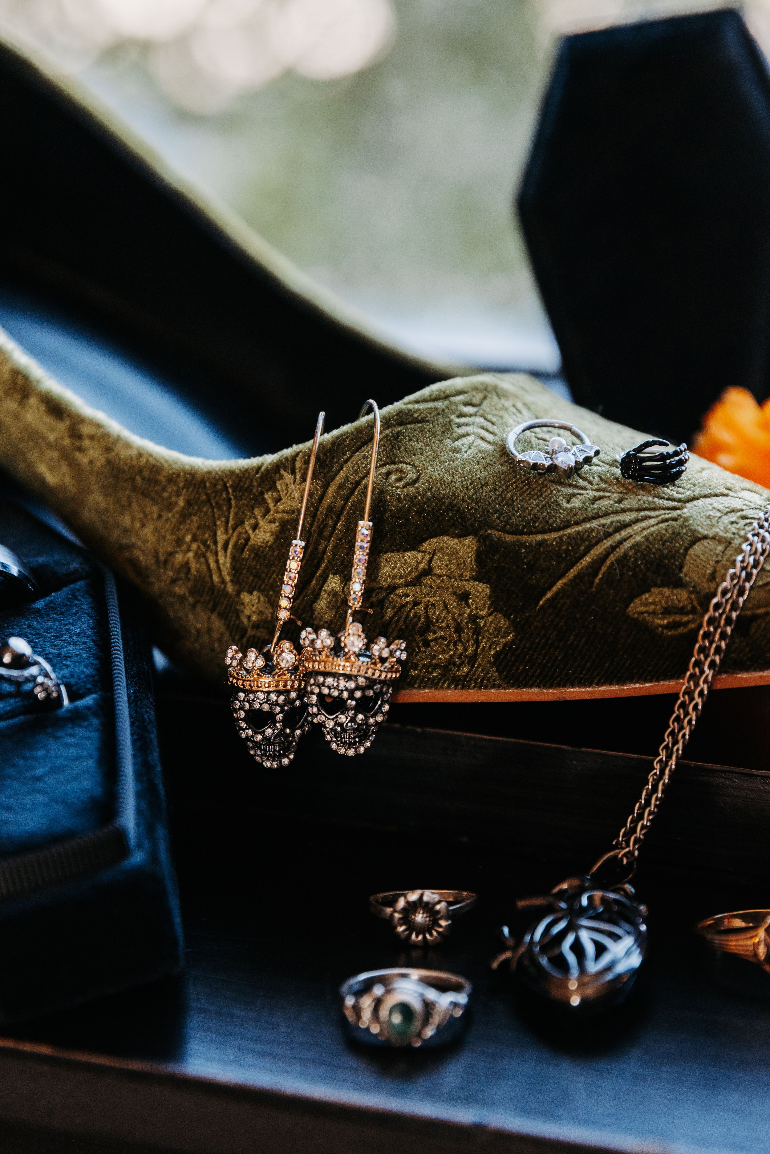 Gothic and alternative wedding details with skeleton earrings