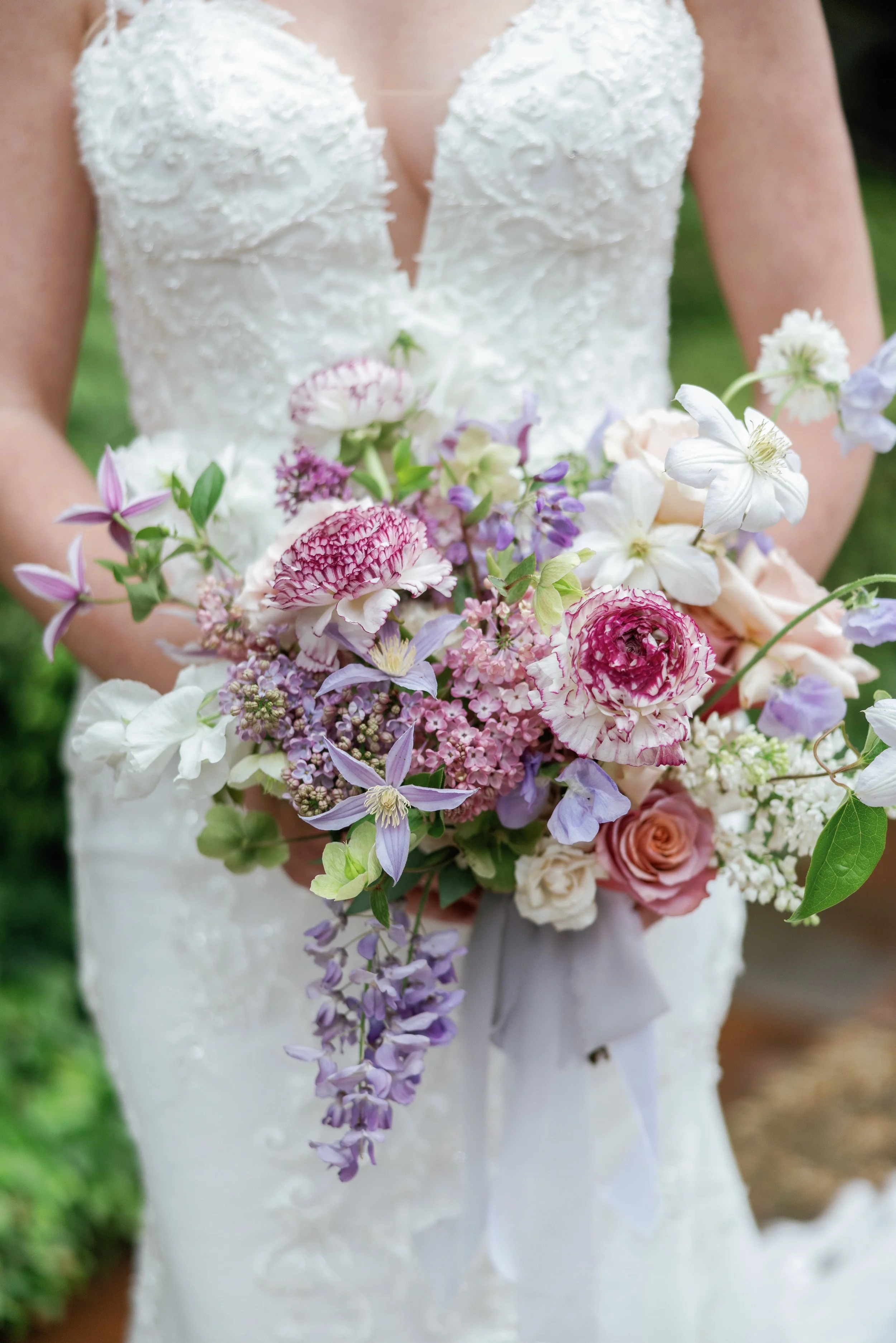 Bridal bouquet with layered florals and textured stems