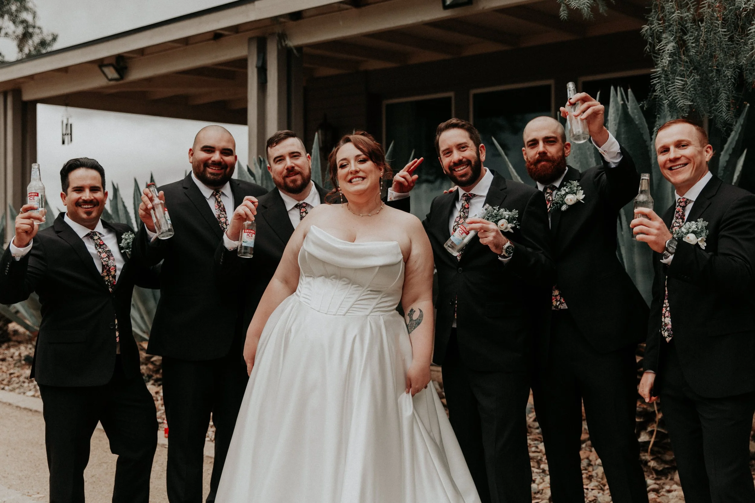 Bride and groomsmen toasting champagne before wedding