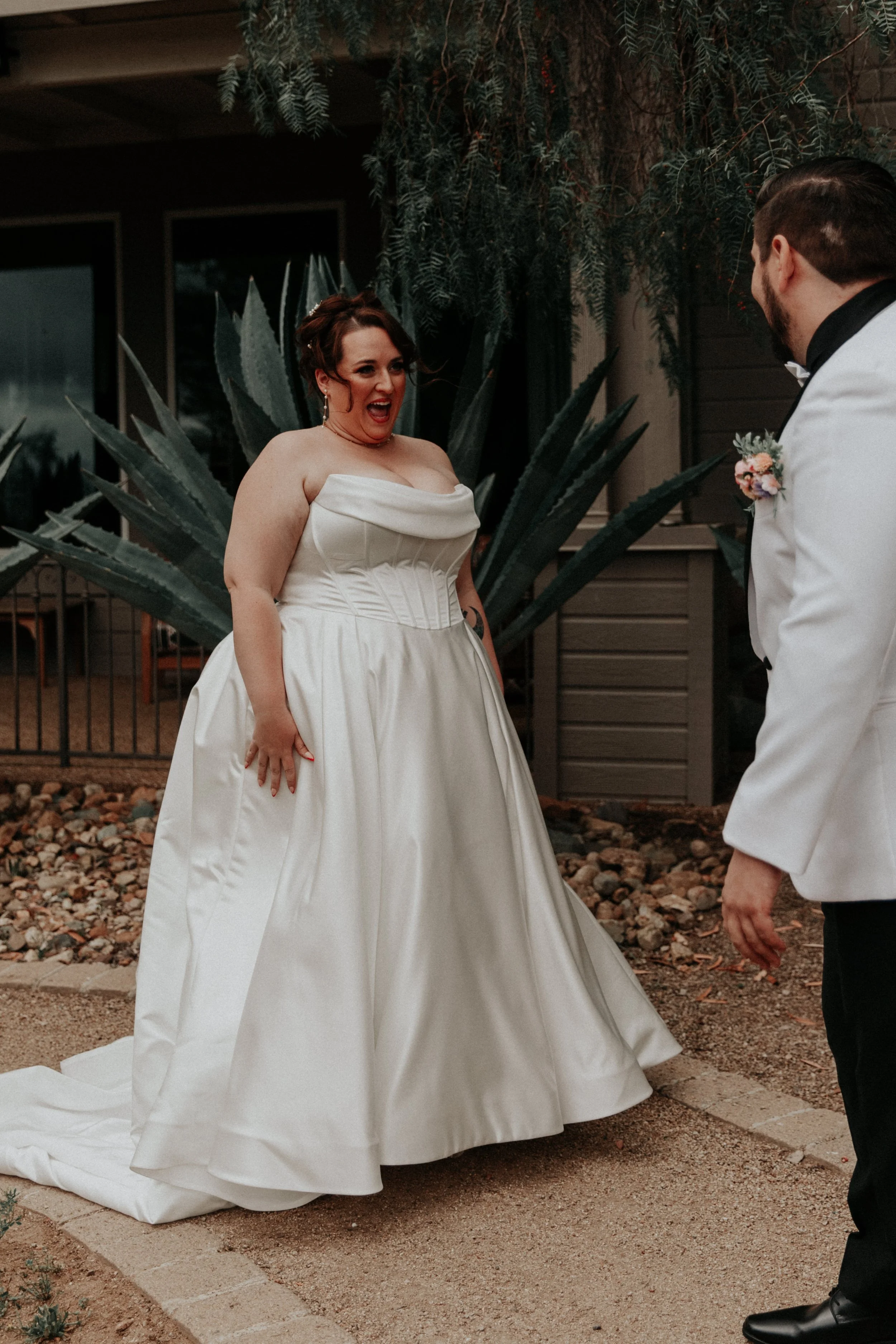 Groom reacting with surprise and excitement during wedding first look